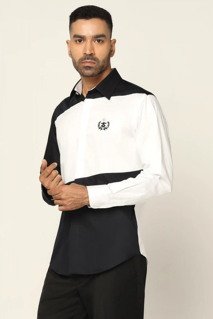Indulge in luxury with our white designer shirt crafted from 100% Giza cotton. Featuring elegant paneling in White and Black, adorned with a crest embroidery on the left side.