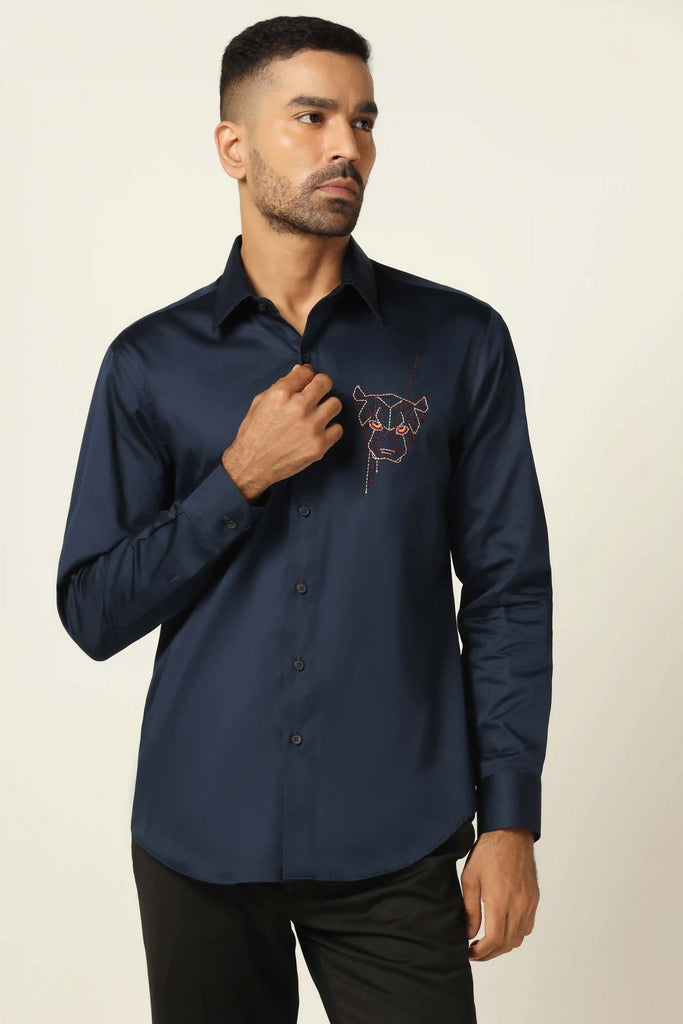 Step up your style game with our Navy shirt featuring contrast embroidery on the left chest panel. Complete with a regular collar and matching buttons.