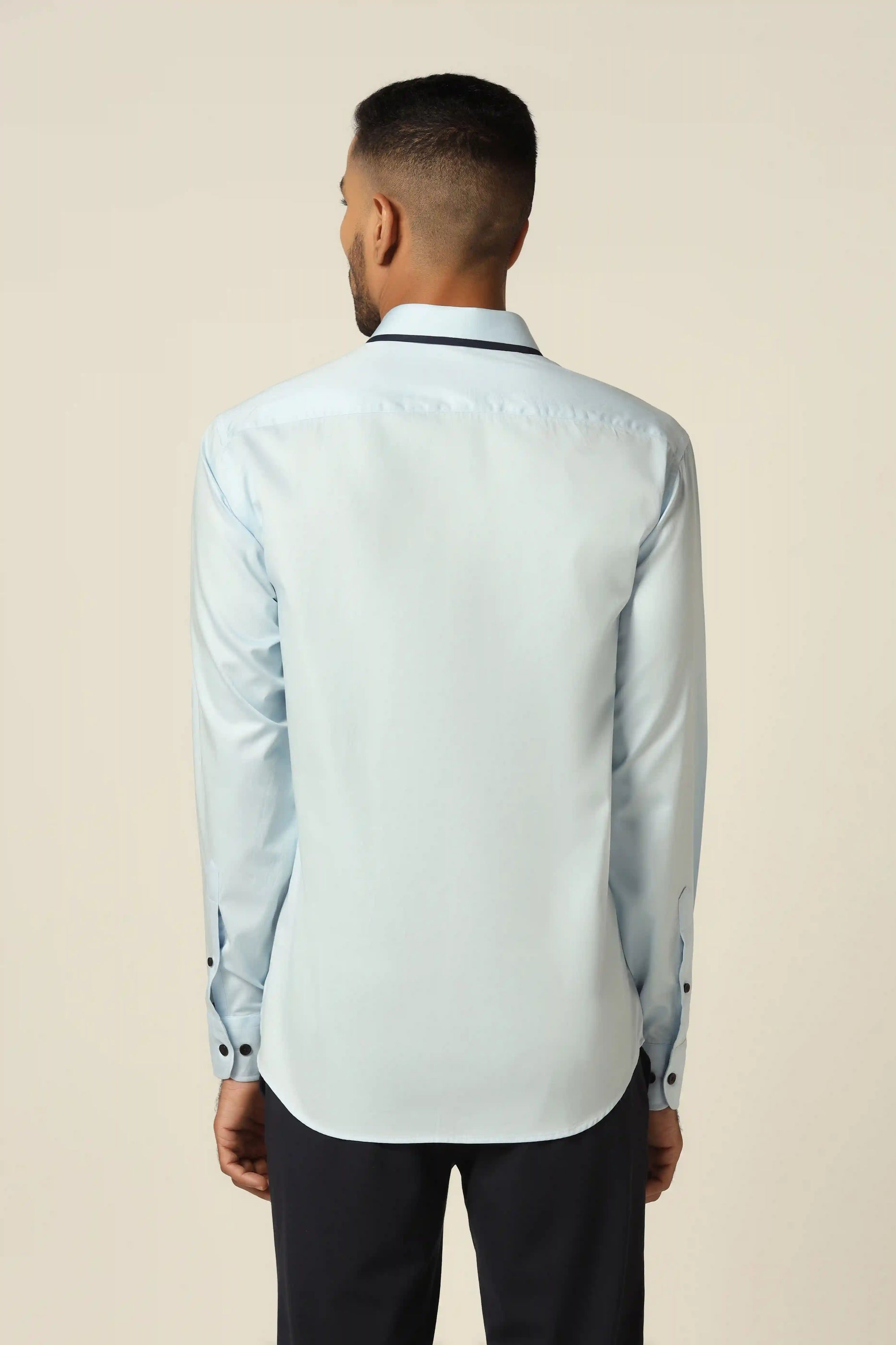 Add elegance to your wardrobe with our stunning blue designer shirt. Shop Now!