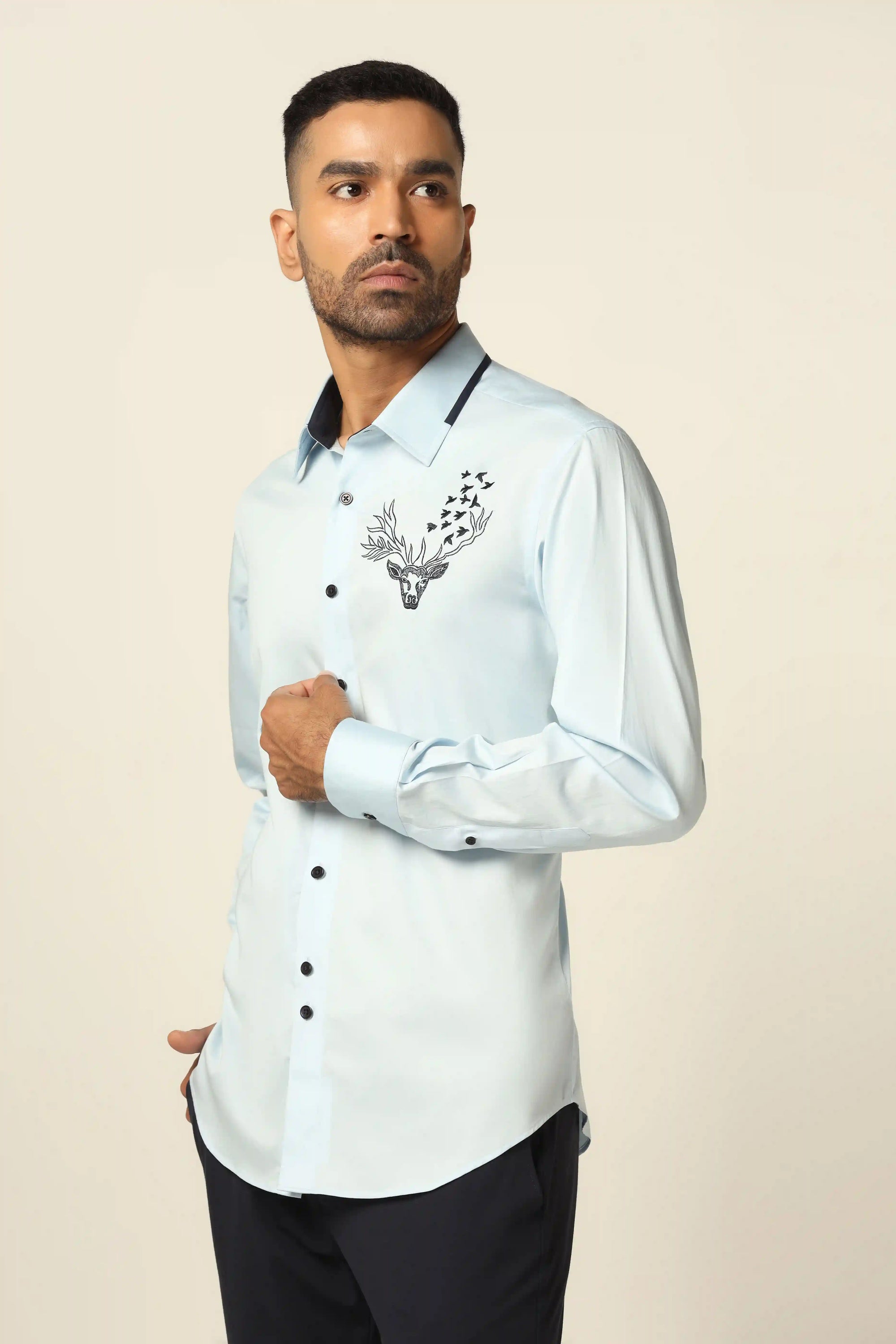 Add elegance to your wardrobe with our stunning blue designer shirt. Shop Now!