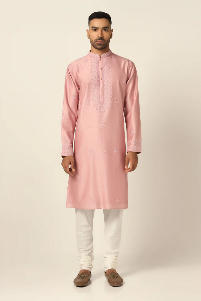 Dress in timeless elegance with our Chanderi Silk Kurta set, featuring exquisite thread embroidery throughout. Paired with matching off-white pajamas for a refined ensemble.