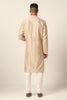 Elegance meets comfort in this Chanderi silk kurta pajama set. Adorned with intricate tonal embroidery, the peach kurta is paired with an off-white churidar pajama.