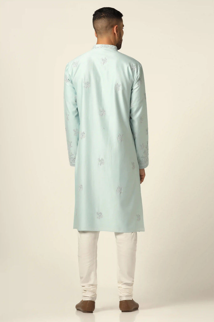 This Chanderi Silk kurta set exudes elegance with its intricate thread embroidery. Paired with matching off-white pajamas, it's a timeless choice for any occasion.