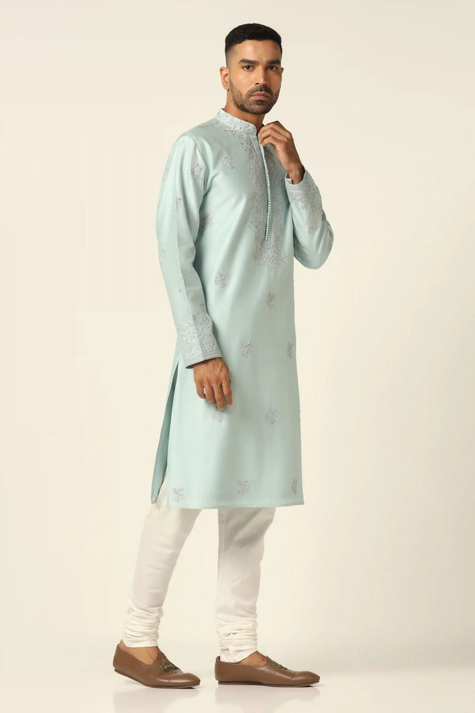 This Chanderi Silk kurta set exudes elegance with its intricate thread embroidery. Paired with matching off-white pajamas, it's a timeless choice for any occasion.