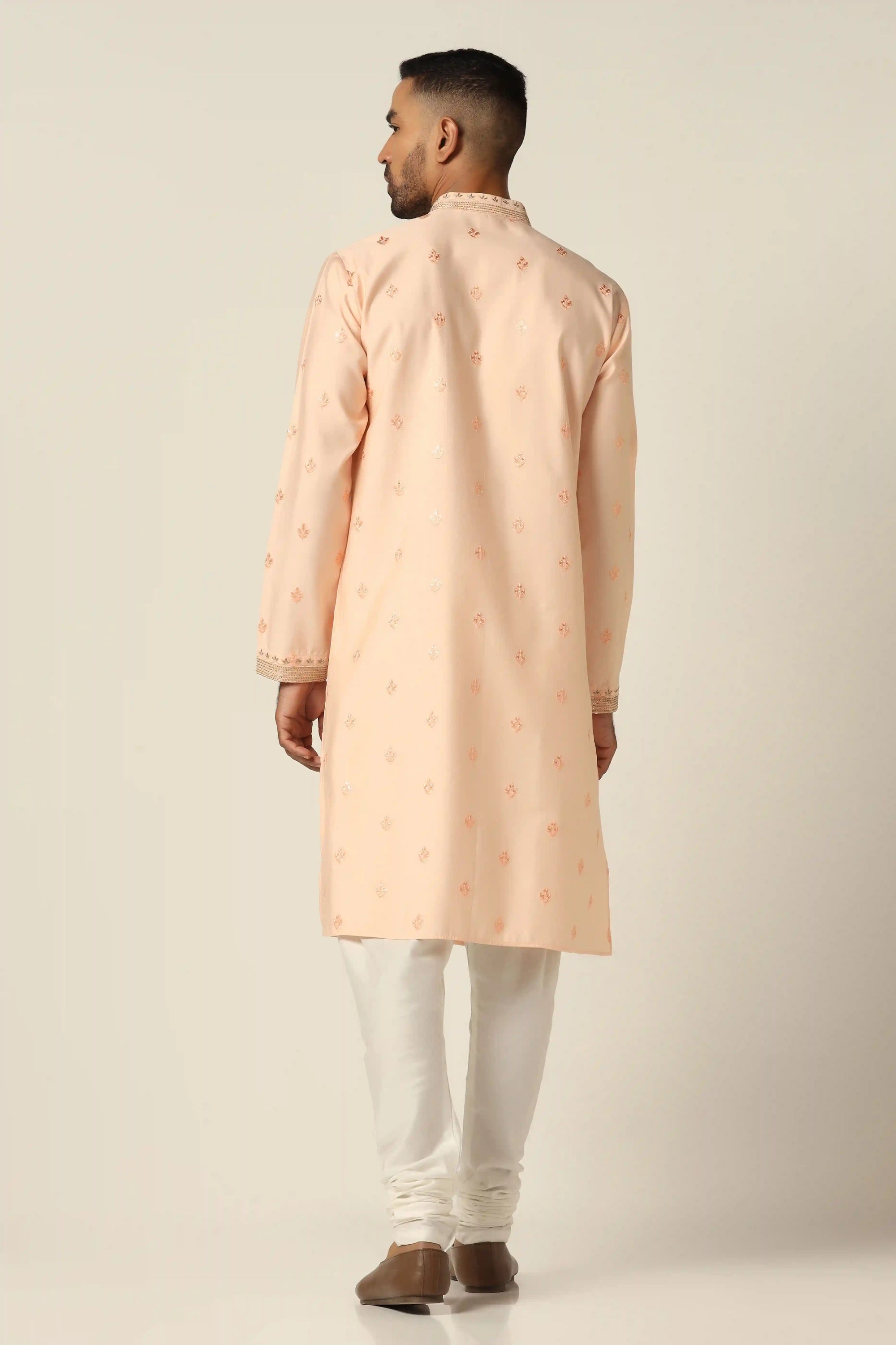 Elevate your style with thread-embroidered Kurta paired with matching off-white pajamas. Shop Now!