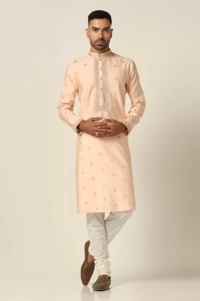 Elevate your style with our thread-embroidered Kurta paired with matching off-white pajamas for a timeless ensemble."