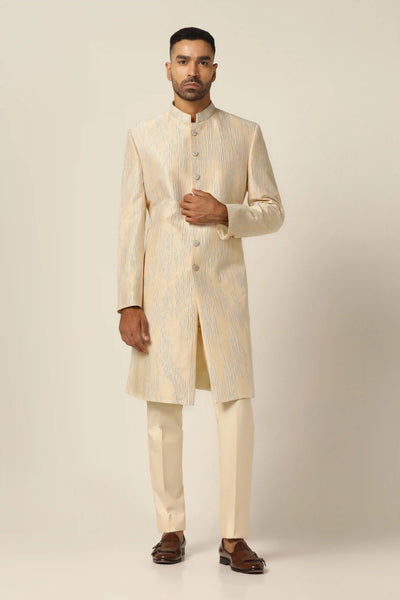 Elevate your style with our raw silk Indo-western set, featuring intricate machine embroidery. Complete with a matching Kurta and pajama for effortless sophistication.