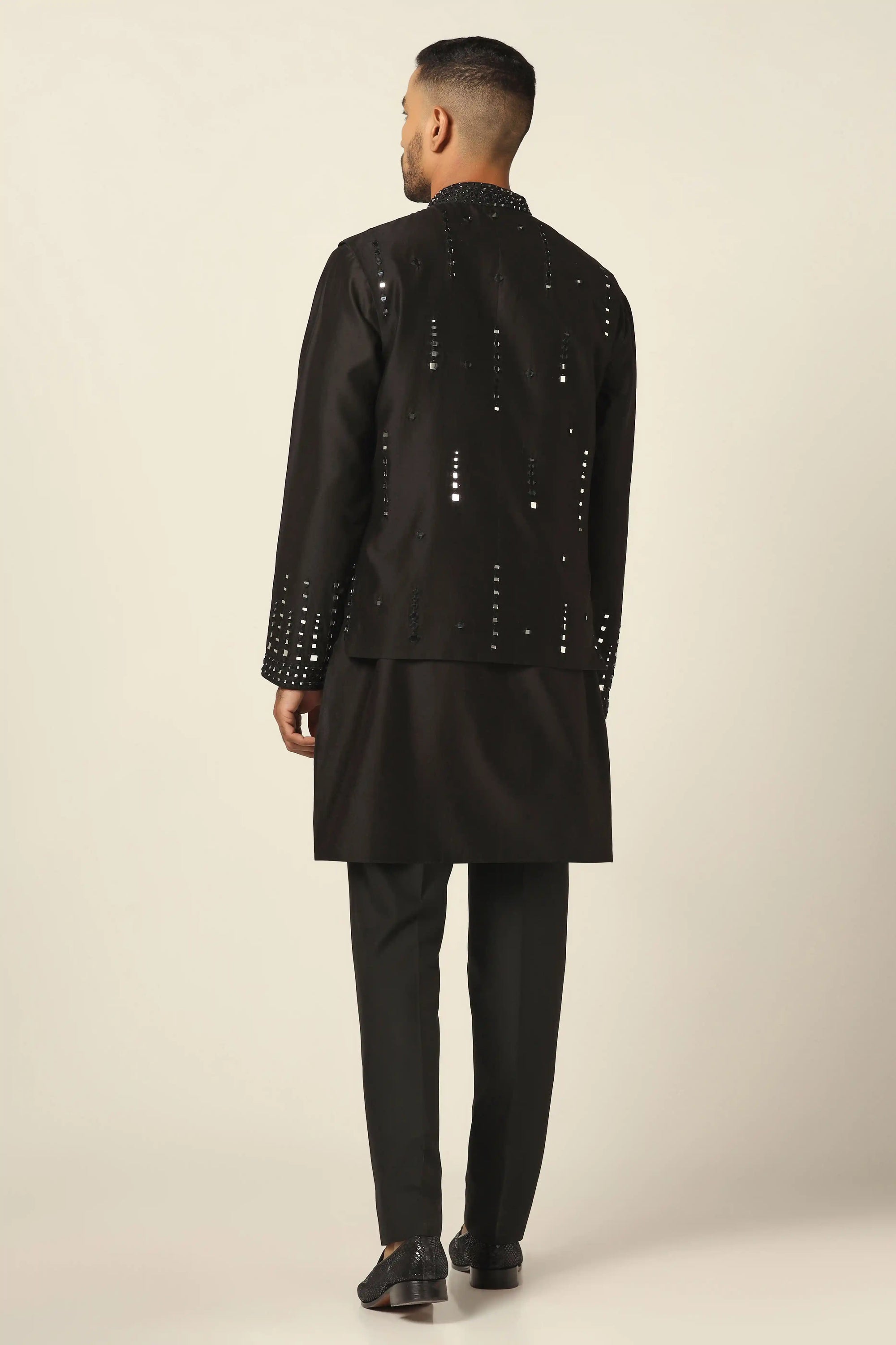 Add glamour to your wardrobe with the Black Nehru Set featuring mirror embroidery. Shop now!