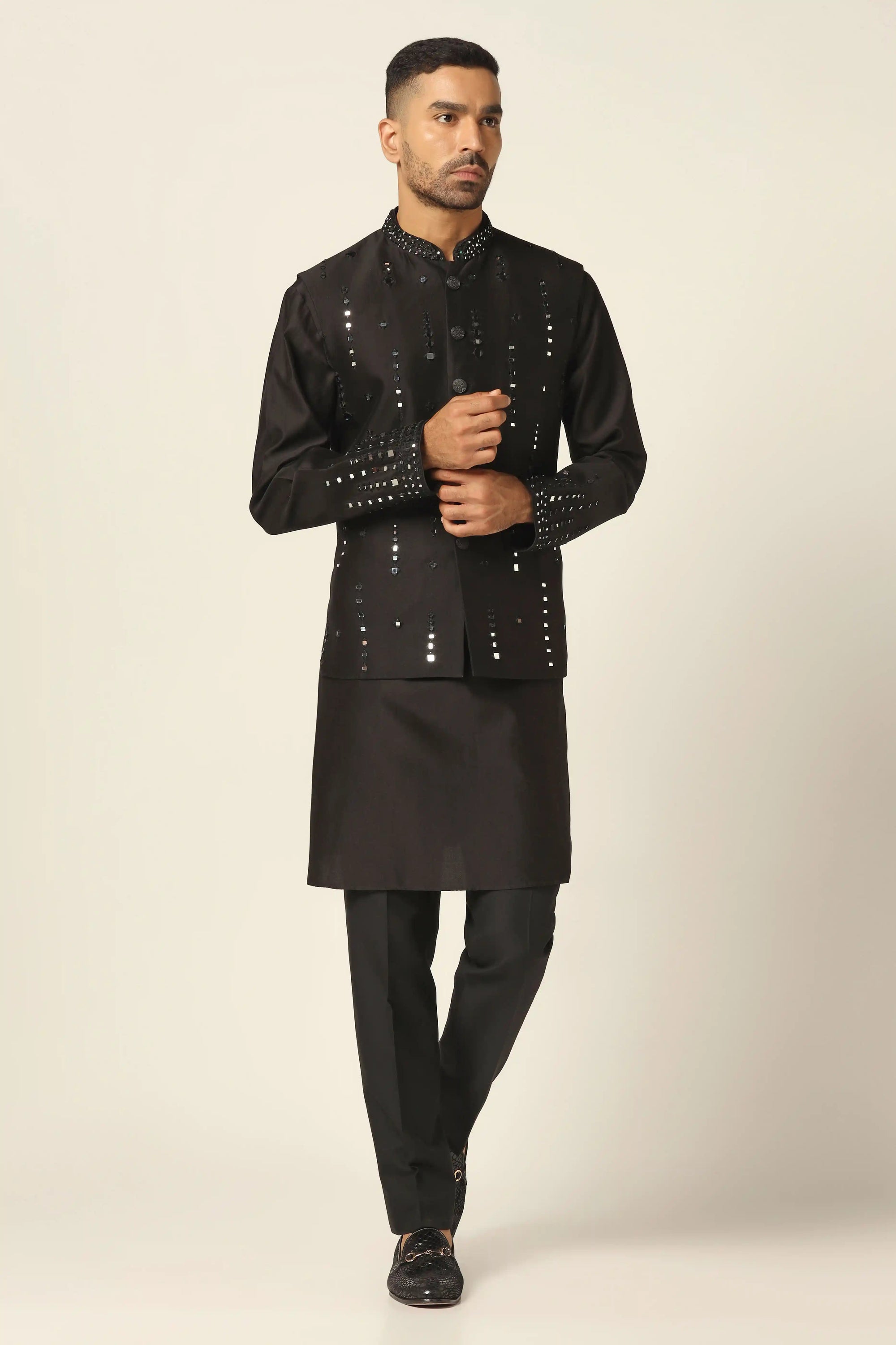 Add glamour to your wardrobe with the Black Nehru Set featuring mirror embroidery. Shop now!