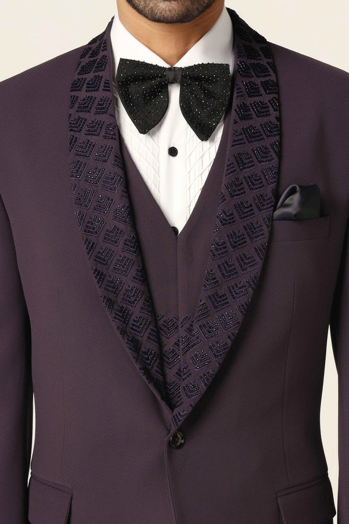 Distinguished elegance redefined. Our Tuxedo features a refined shawl collar with subtle embroidery, complemented by a matching waistcoat and contrasting trousers for a standout ensemble.