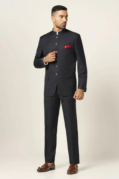 Dress with timeless elegance in our Navy Bandhgala suit, crafted from super fine wool fabric. Accentuated by subtle collar embroidery for a classic touch.