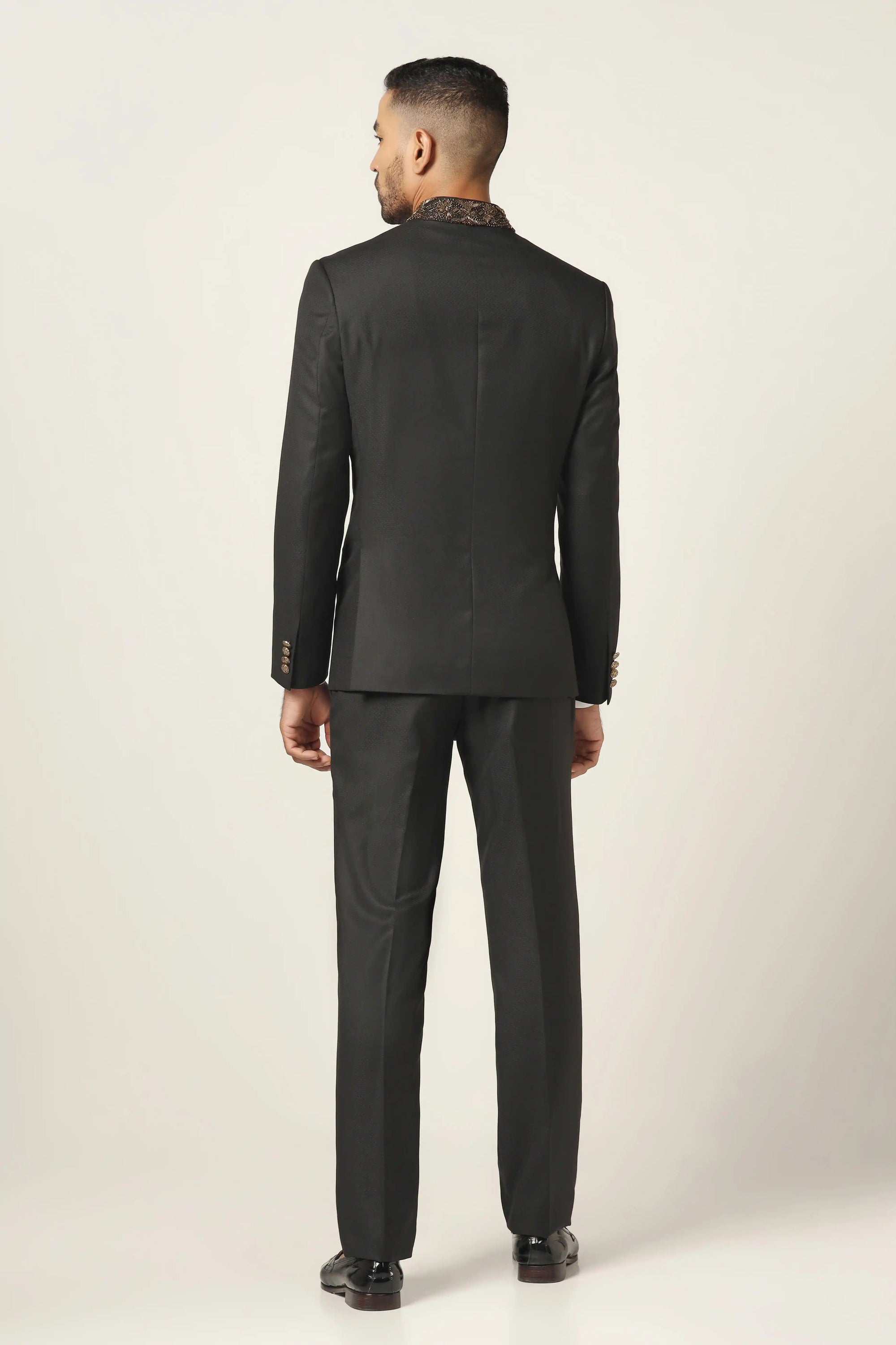 Add refined charm with a black bandhgala suit, delicately embroidered for a rich look. Shop Now!
