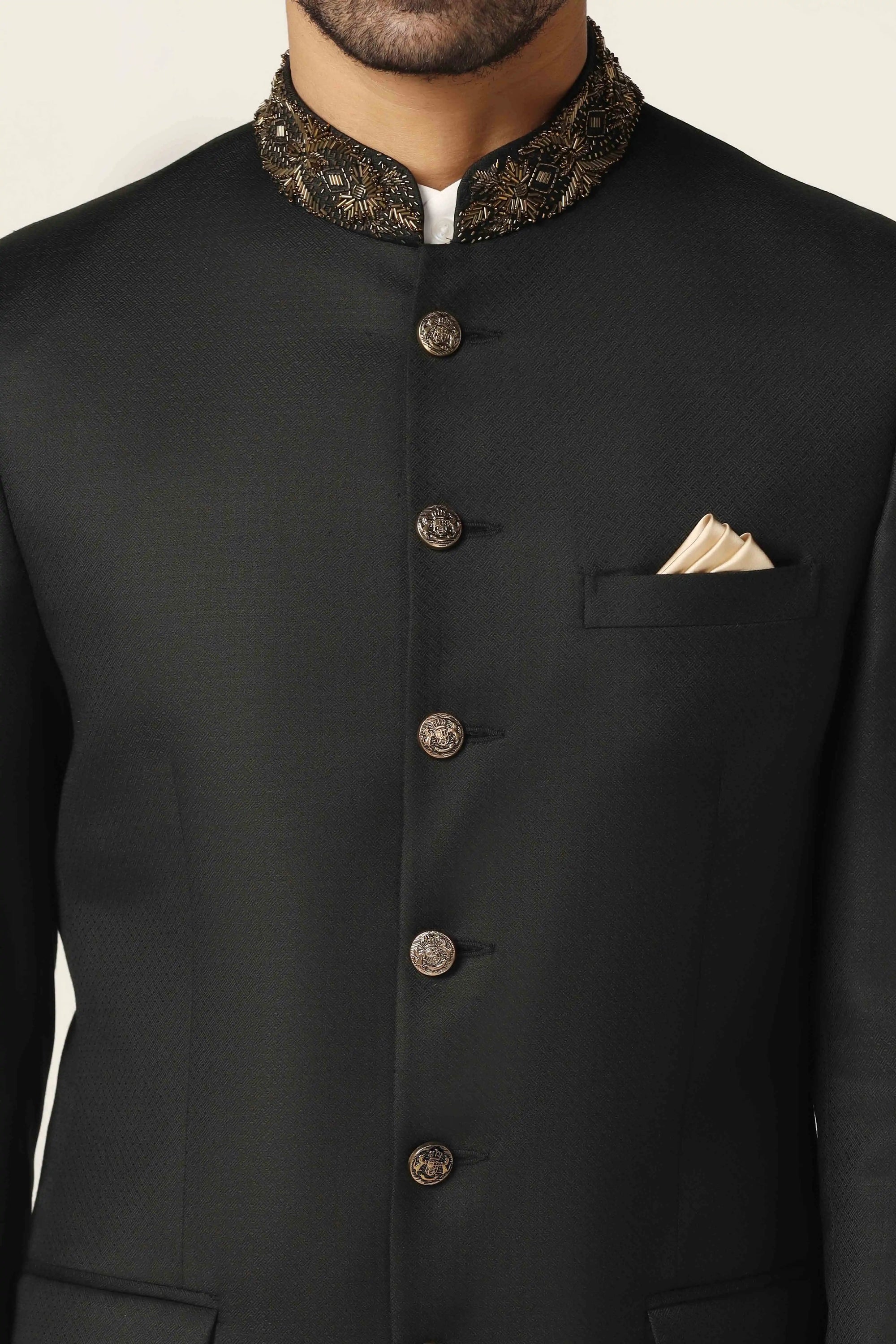 Add refined charm with a black bandhgala suit, delicately embroidered for a rich look. Shop Now!