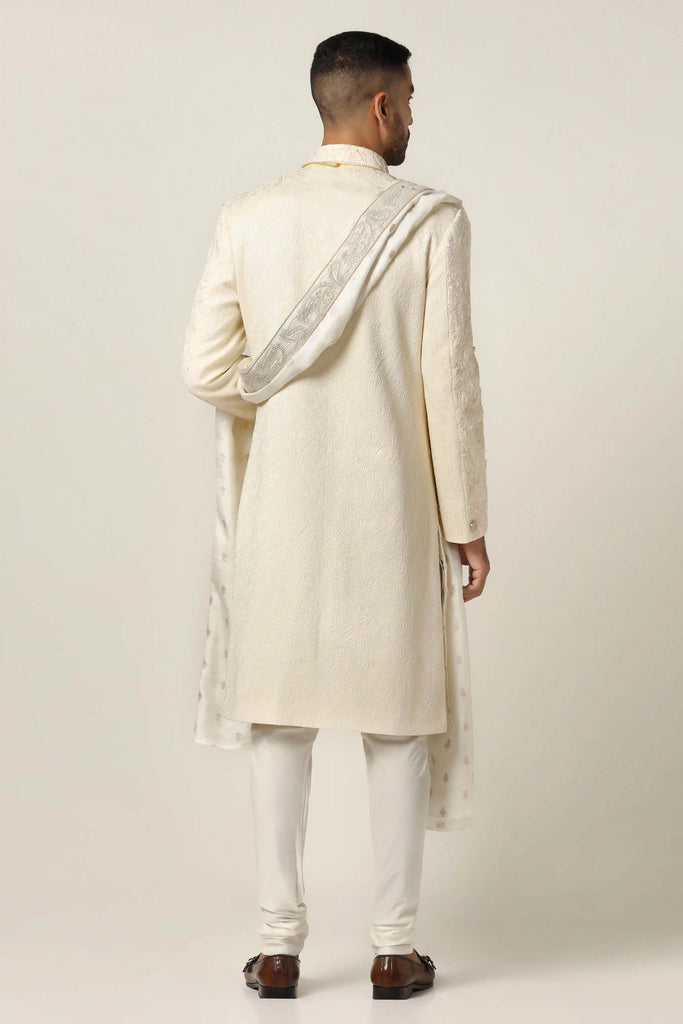 Elevate your style with our classic Sherwani featuring tonal white embroidery on the front & back. Complete with Kurta and Pajama ensemble.