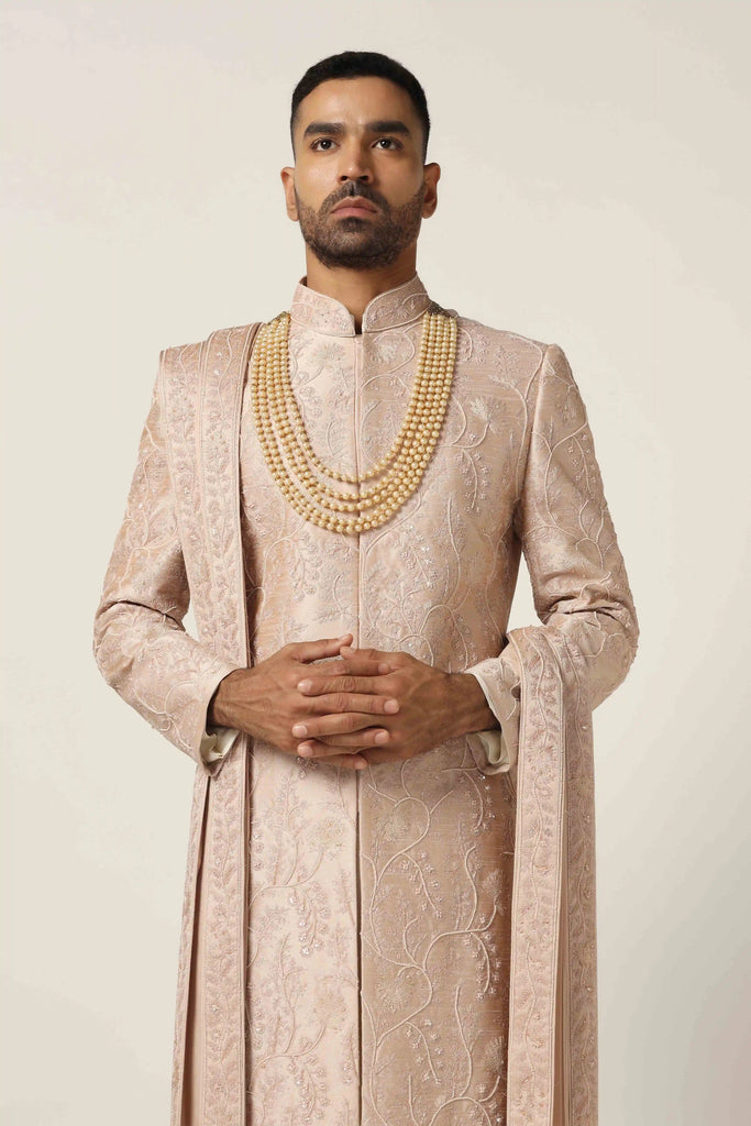 Elevate your style with our Raw silk Sherwani set, adorned with intricate machine embroidery. Complete with Kurta Pajama ensemble for timeless sophistication.