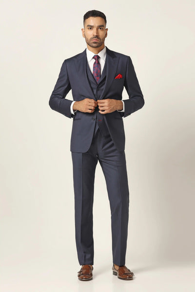 Dive into sophistication with our Navy pinstripe 3-piece suit. Crafted from fine wool blend fabric, featuring a distinguished peak lapel. The matched contrast fabric waistcoat adds flair. Complete with matching pants.