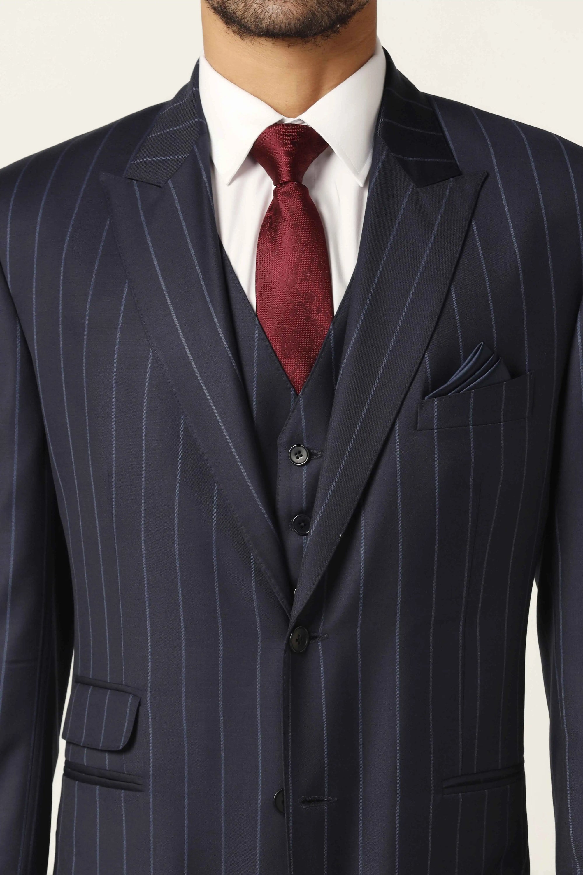 Redefine formalwear with this navy blue suit, featuring a sleek pinstripe pattern. Shop now!