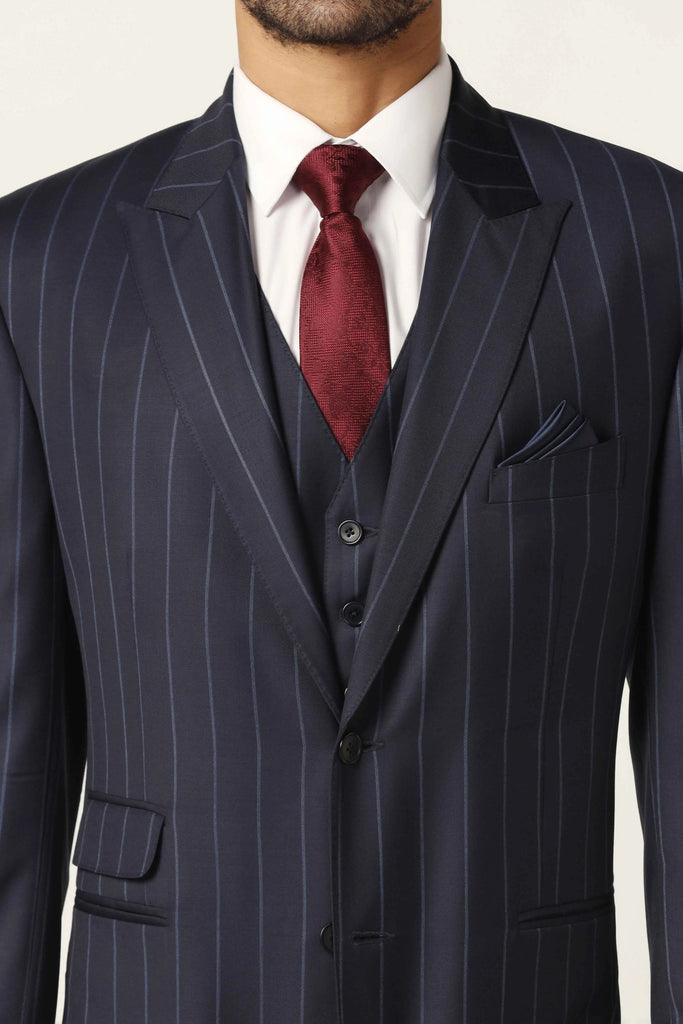 Step into sophistication with our Navy 3-Piece Suit. Striking navy blue pin-stripe fabric, notched lapel, 2-button coat. Complete ensemble with matching trousers and waistcoat.