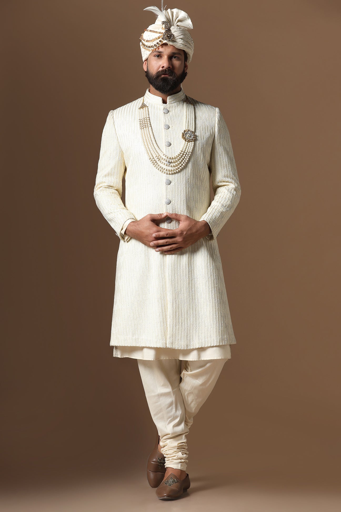 Distinguished by exquisite tonal threadwork, this Off-White Sherwani exudes elegance. Shop Now!