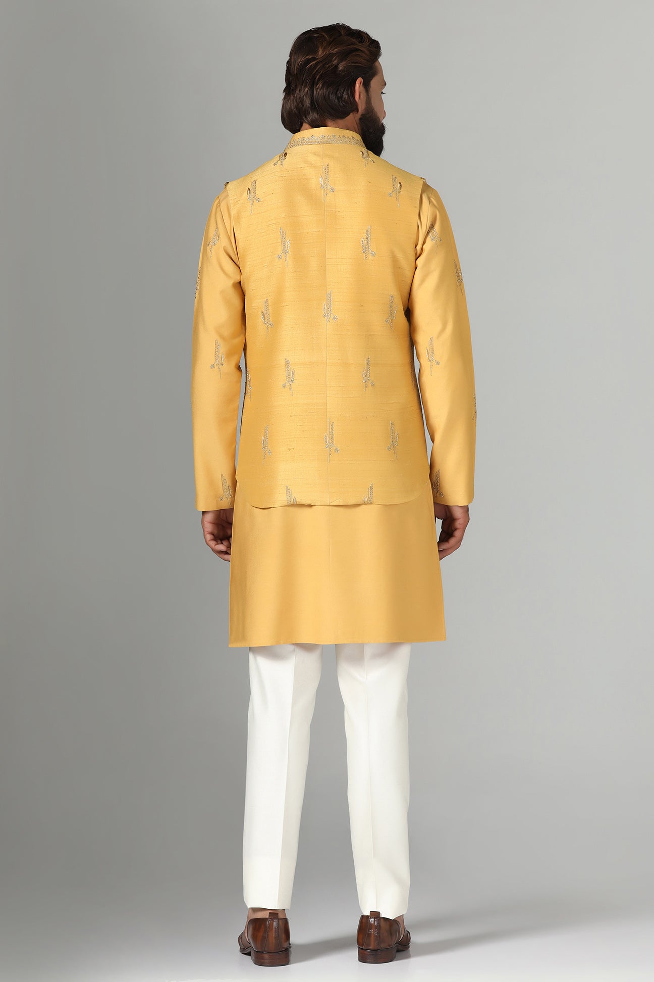 Elevate your style with our Raw-Silk Nehru jacket adorned with delicate embroidery. Shop Now!