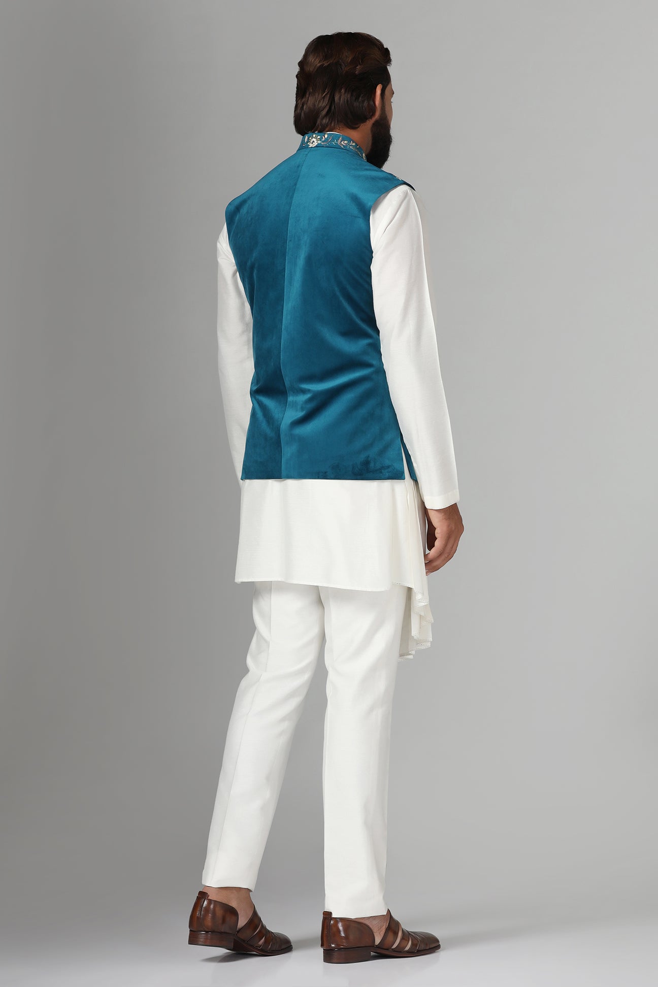 Step into elegance with our velvet Nehru jacket, boasting asymmetric floral embroidery. Shop Now!