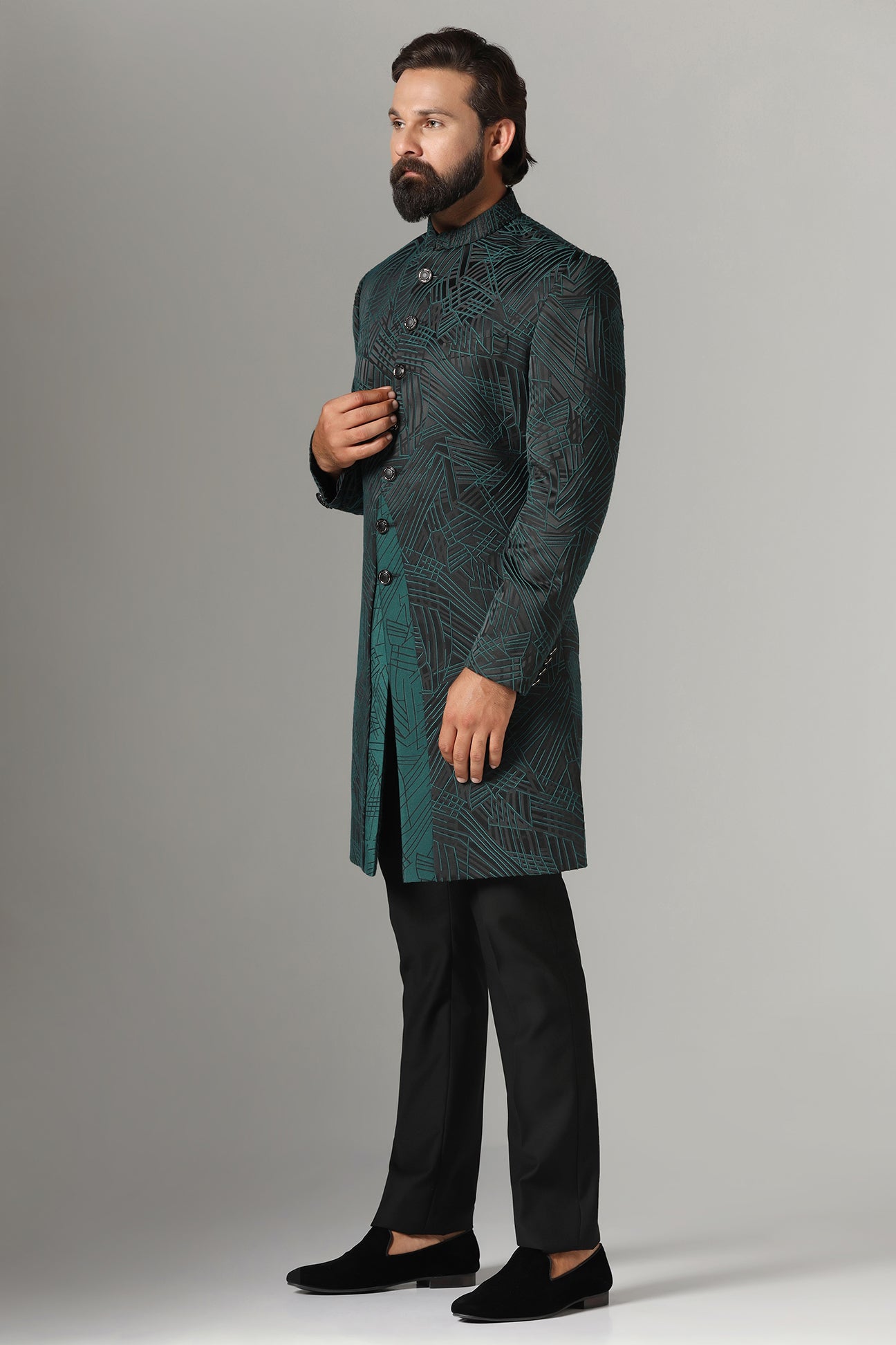 This black Indowestern is highlighted with green line embroidery all across the garment. Shop Now!