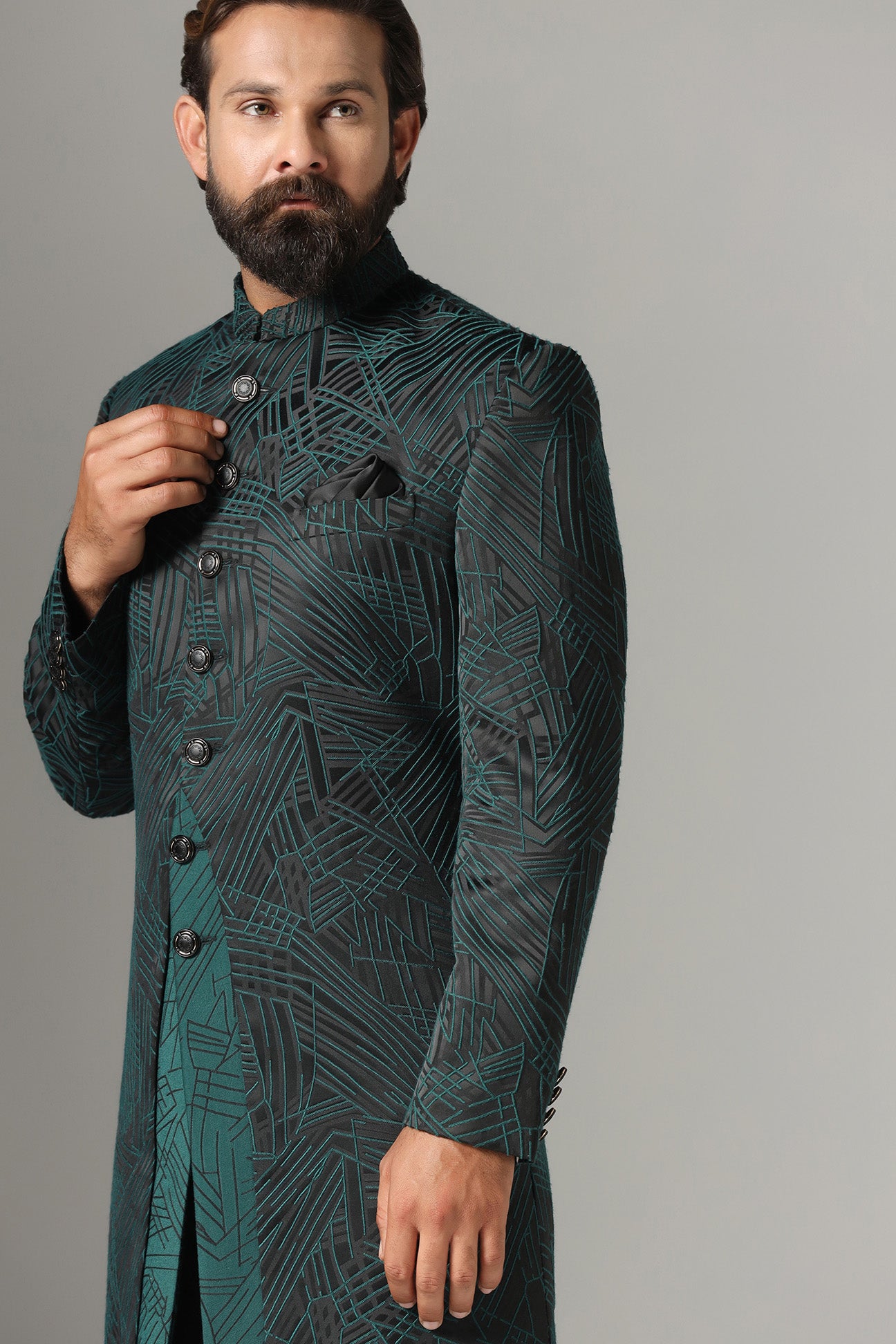 This black Indowestern is highlighted with green line embroidery all across the garment. Shop Now!