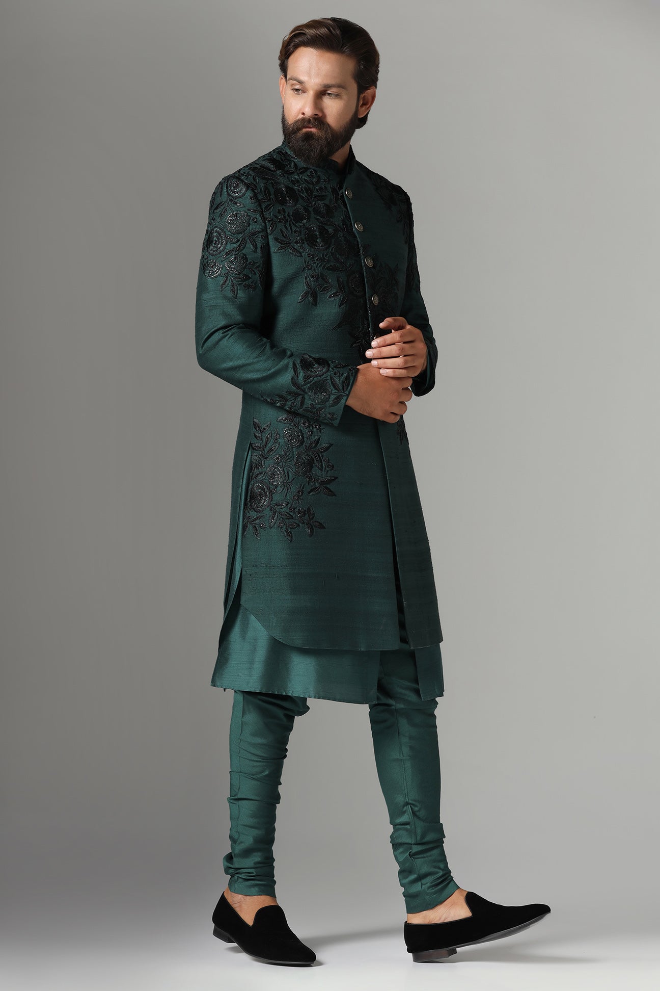 This green Indo-Western features tonal embroidery on the garment. Shop Now!