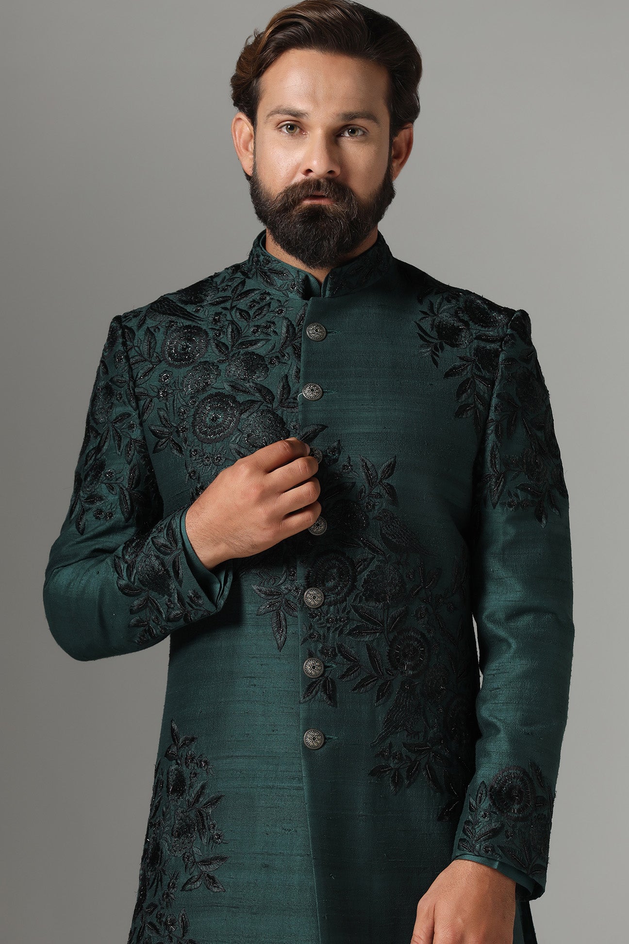 This green Indo-Western features tonal embroidery on the garment. Shop Now!