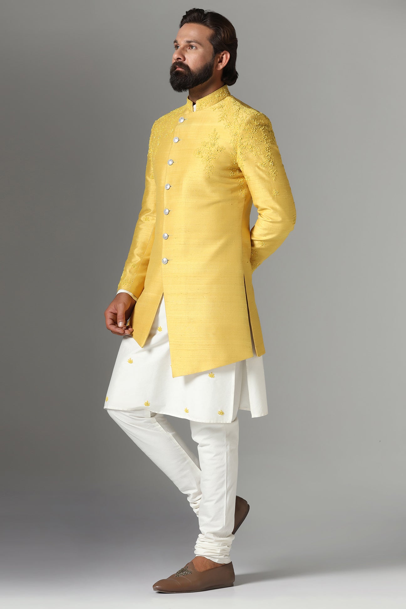 This Yellow Indo-western features subtle embroidery on the garment. Shop Now!