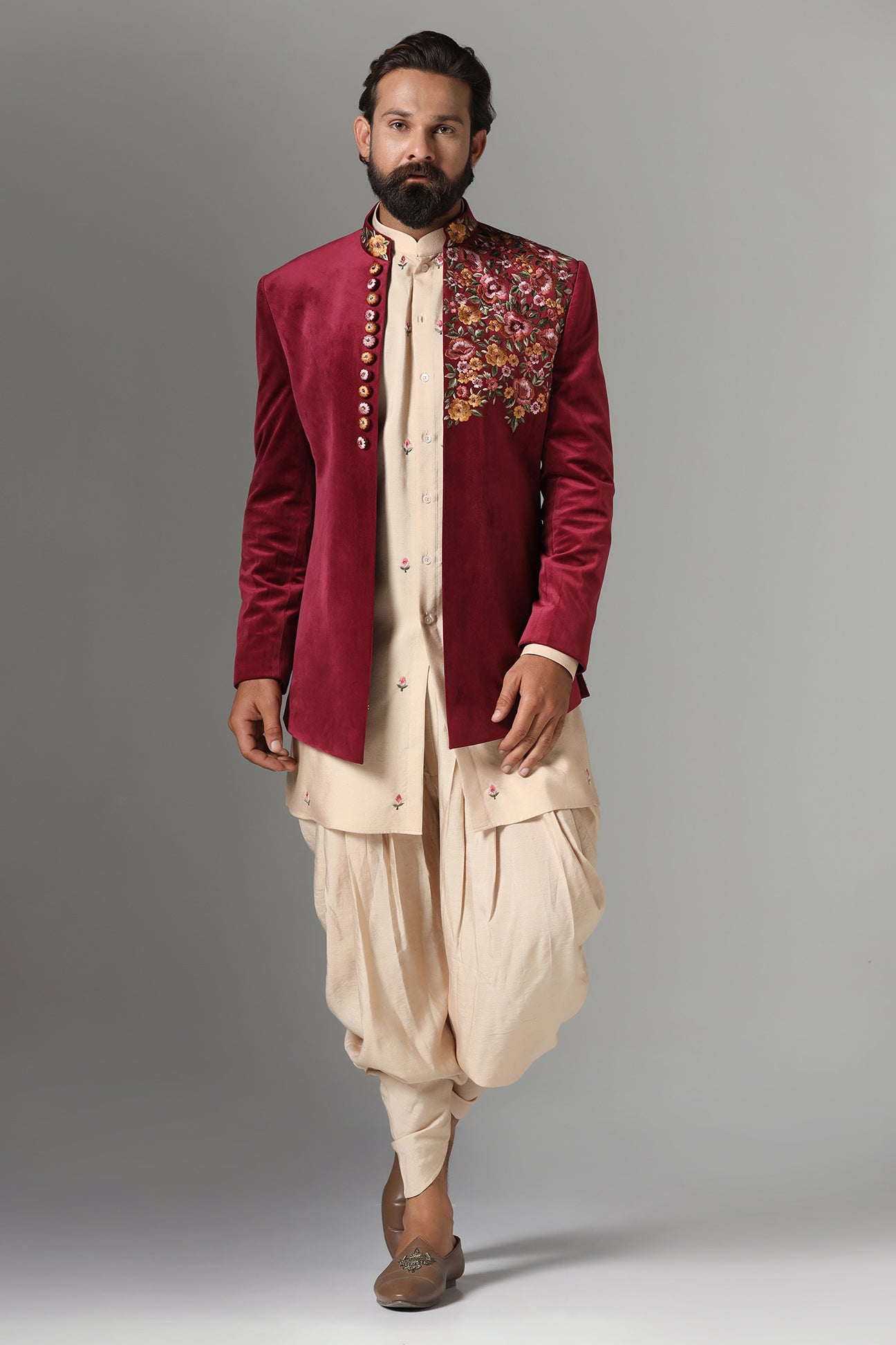 This Indo-Western features multi-coloured floral embroidery on the collar and left panel. Shop Now!