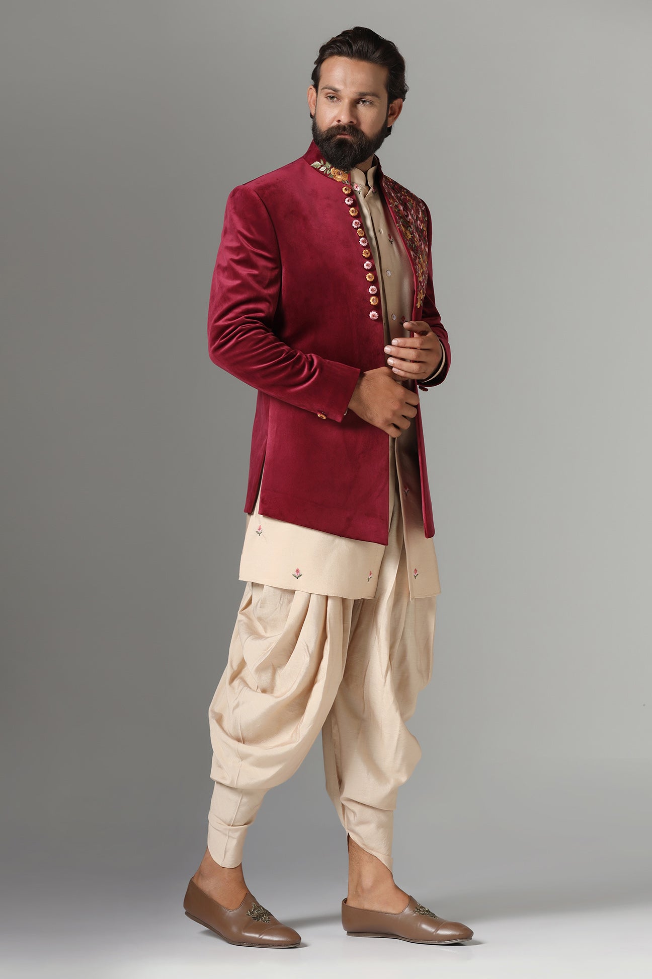 This Indo-Western features multi-coloured floral embroidery on the collar and left panel. Shop Now!
