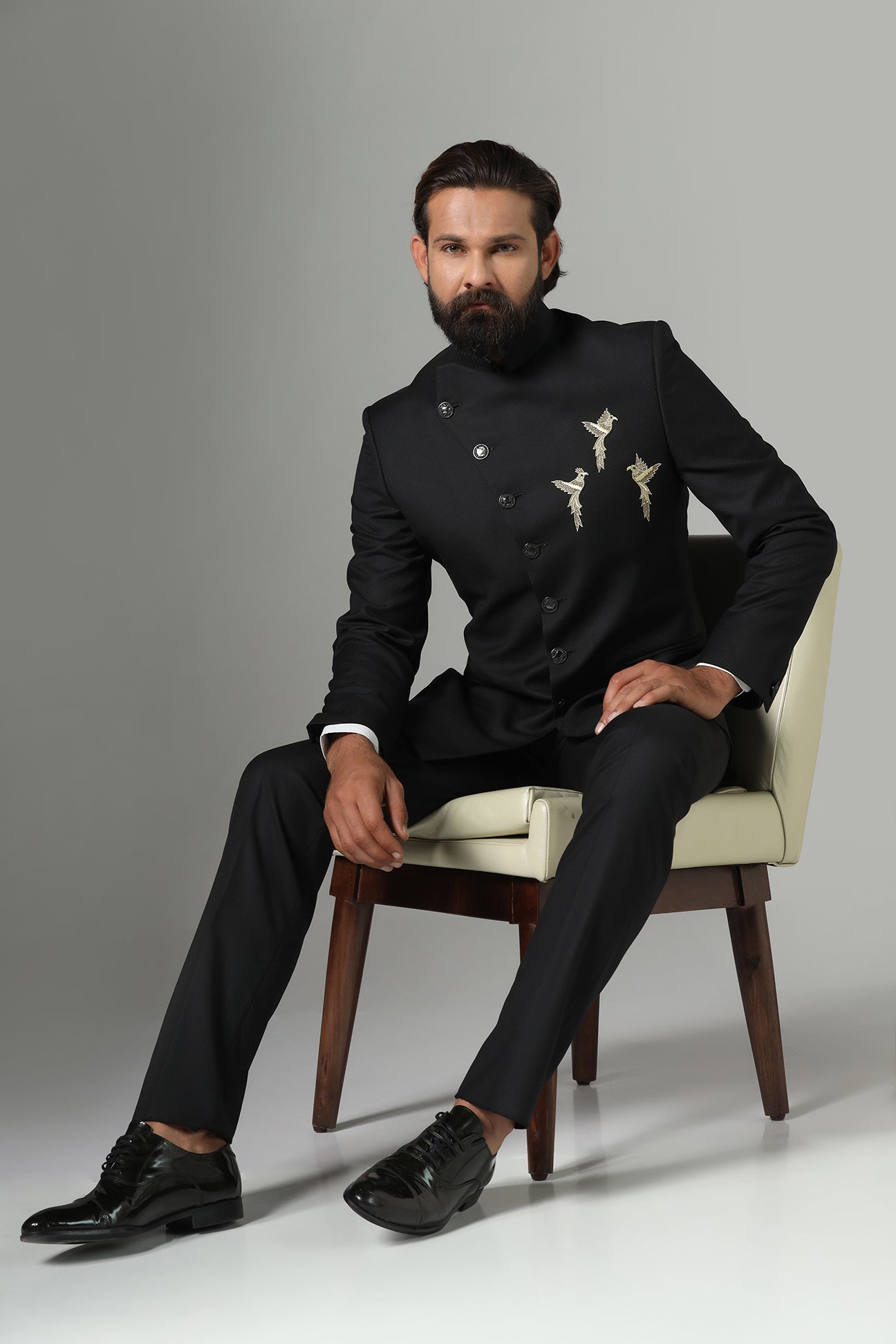 Asymmetric Black Bandhgala suit crafted from wool-rich fabric. Shop now!