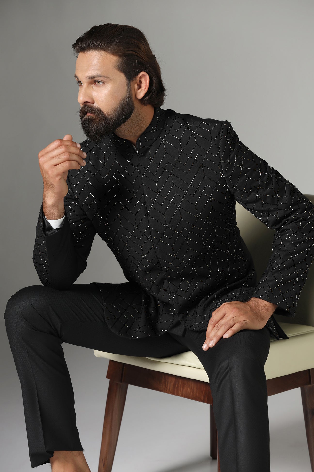 Shop the classic black Bandhgala suit with intricate embroidery for a sophisticated look. Shop now!