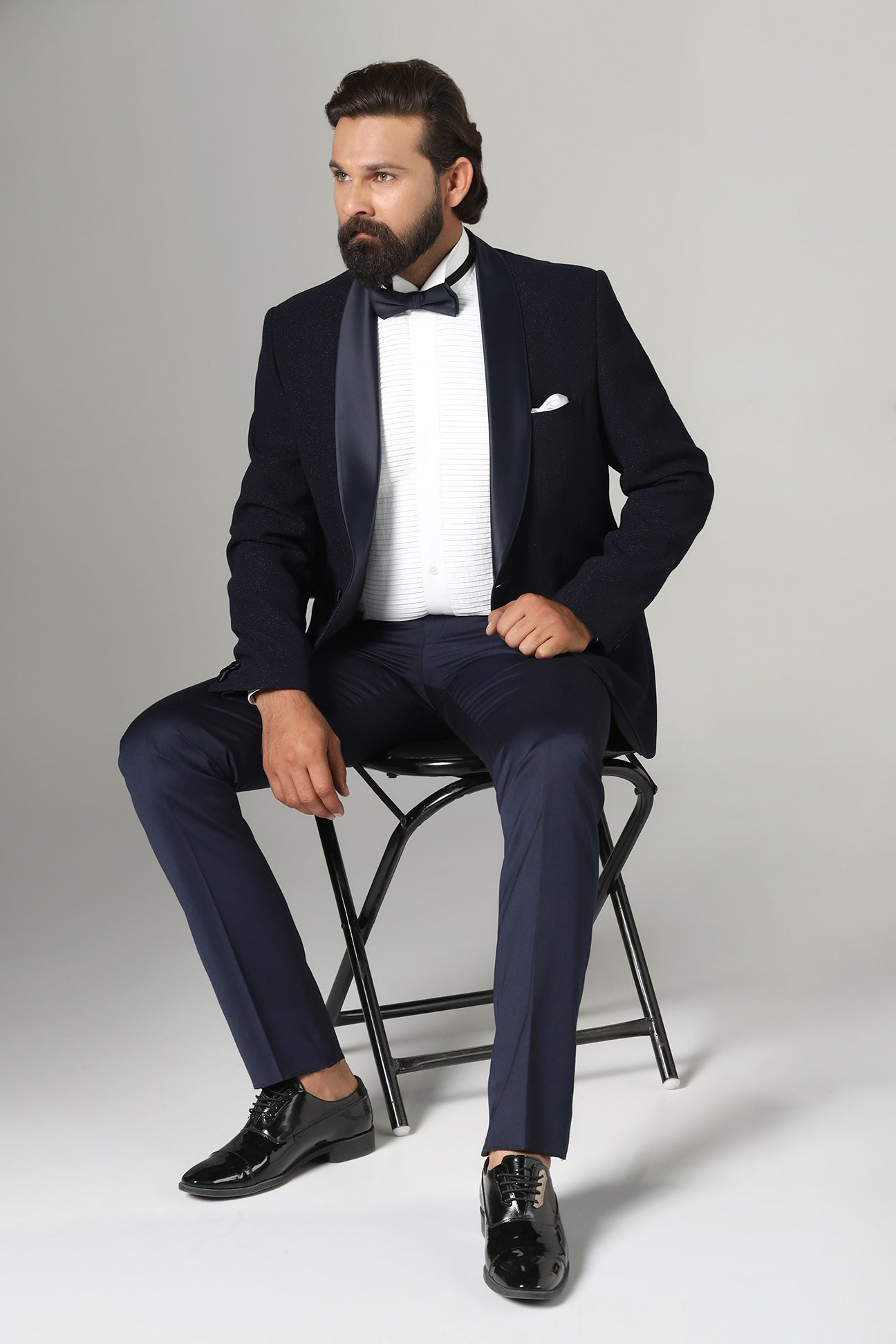 Distinguished elegance in our Dark Blue Textured Tuxedo. Shop Now!