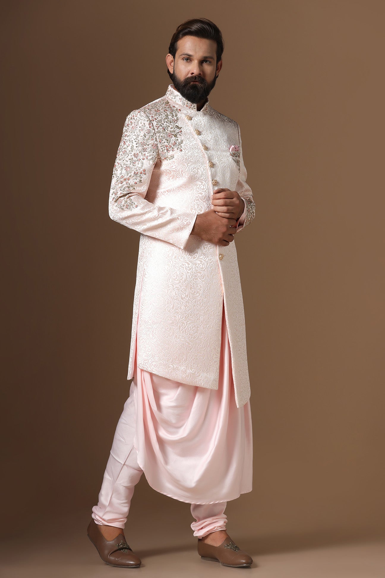 This Indowestern is highlighted by panelled embroidery across the shoulder and sleeve. Shop Now!