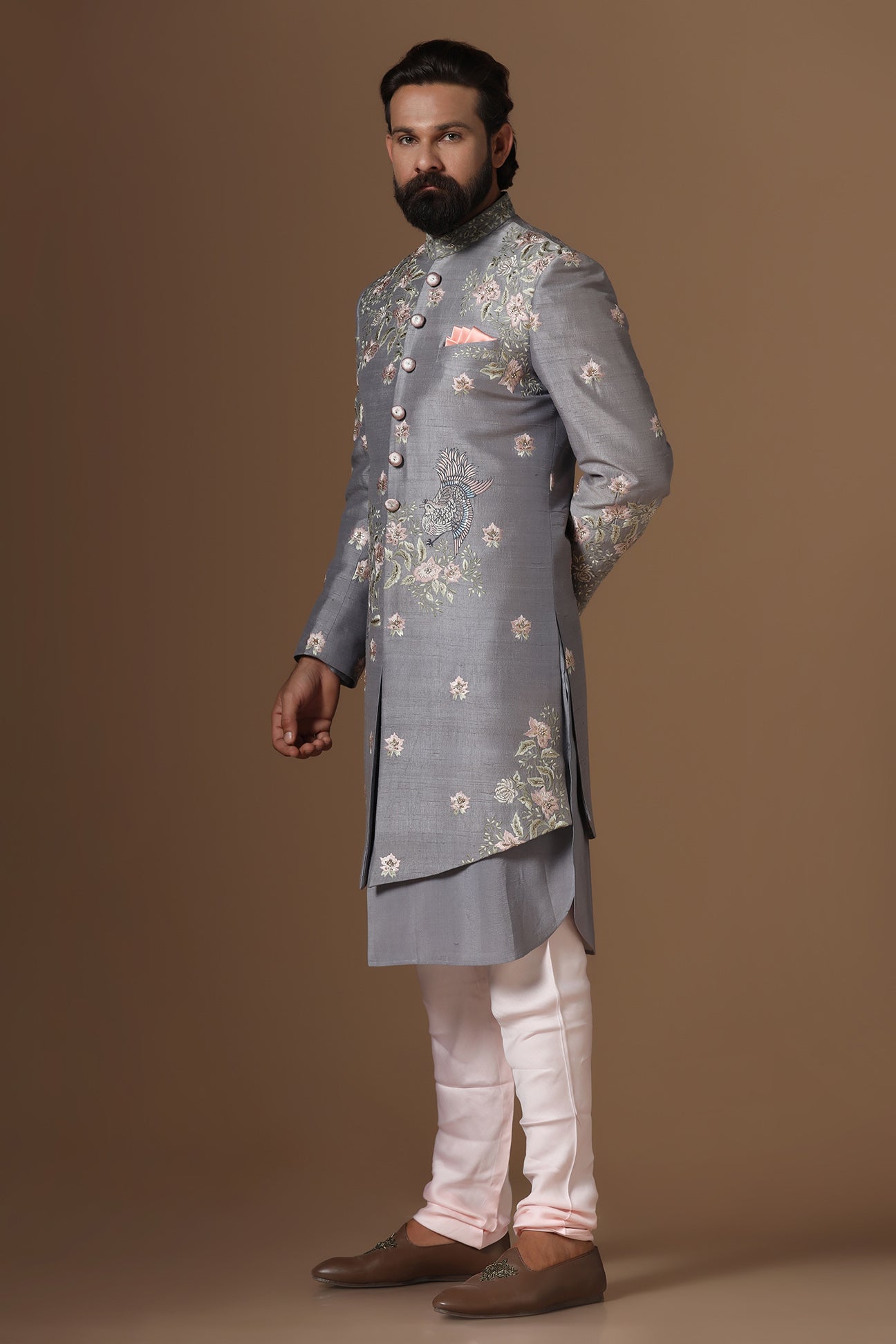 This grey Indowestern is highlighted with floral motif embroidery. Shop Now!