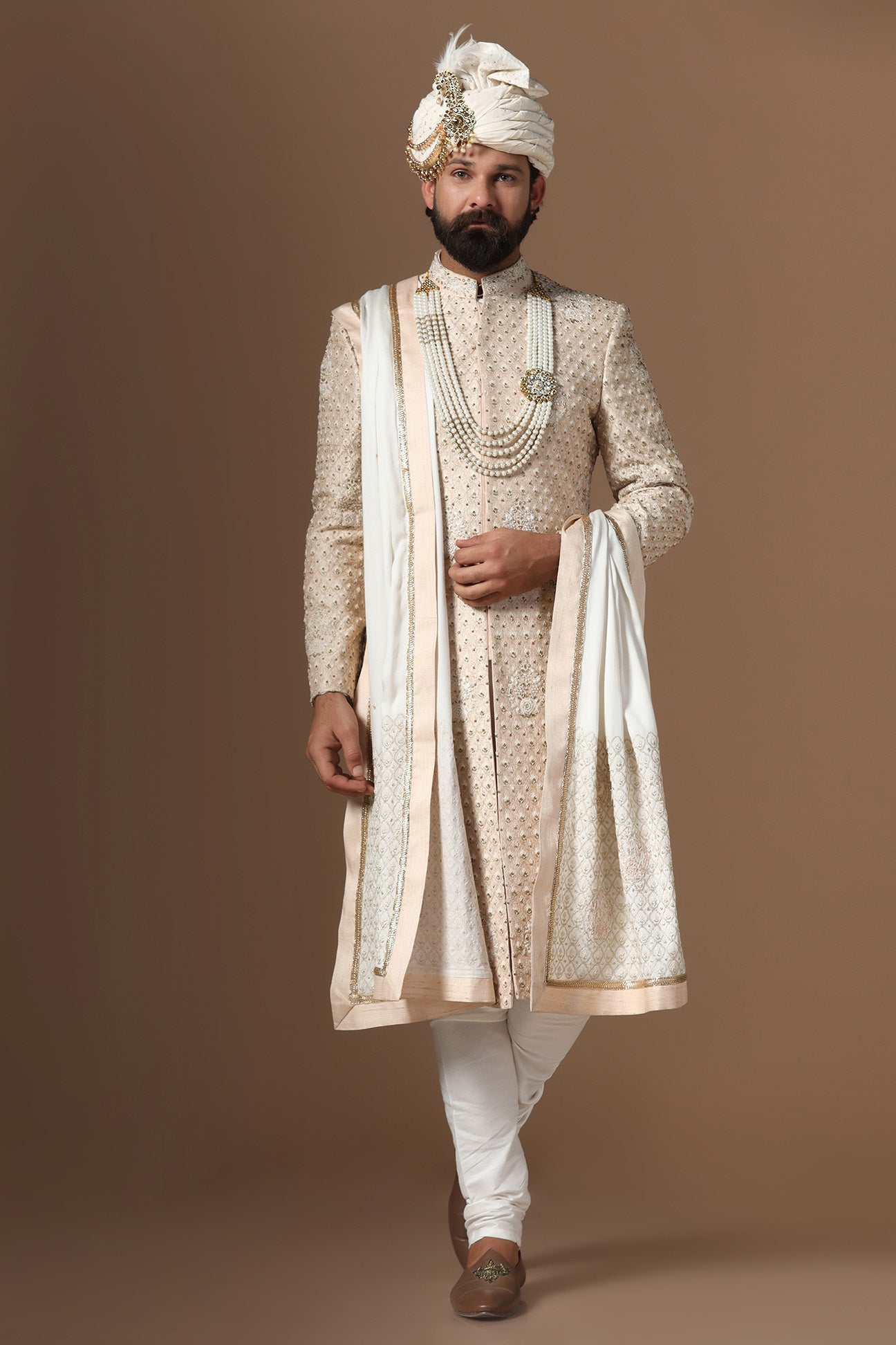Elegance meets tradition in this light peach sherwani. Shop Now!