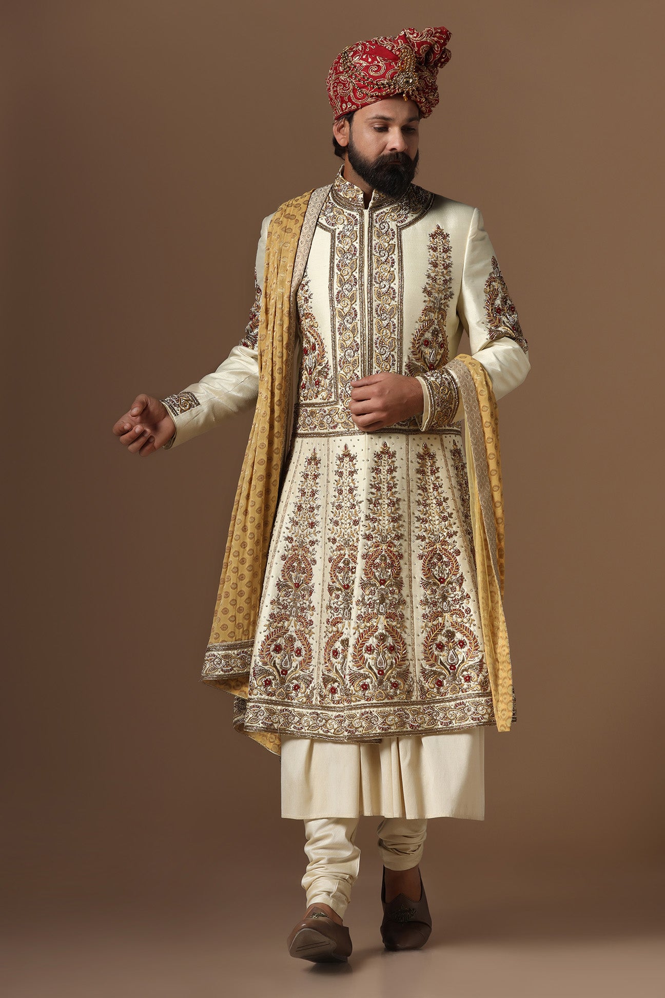 This Off-White Sherwani is highlighted by floral embroidery. Shop Now!