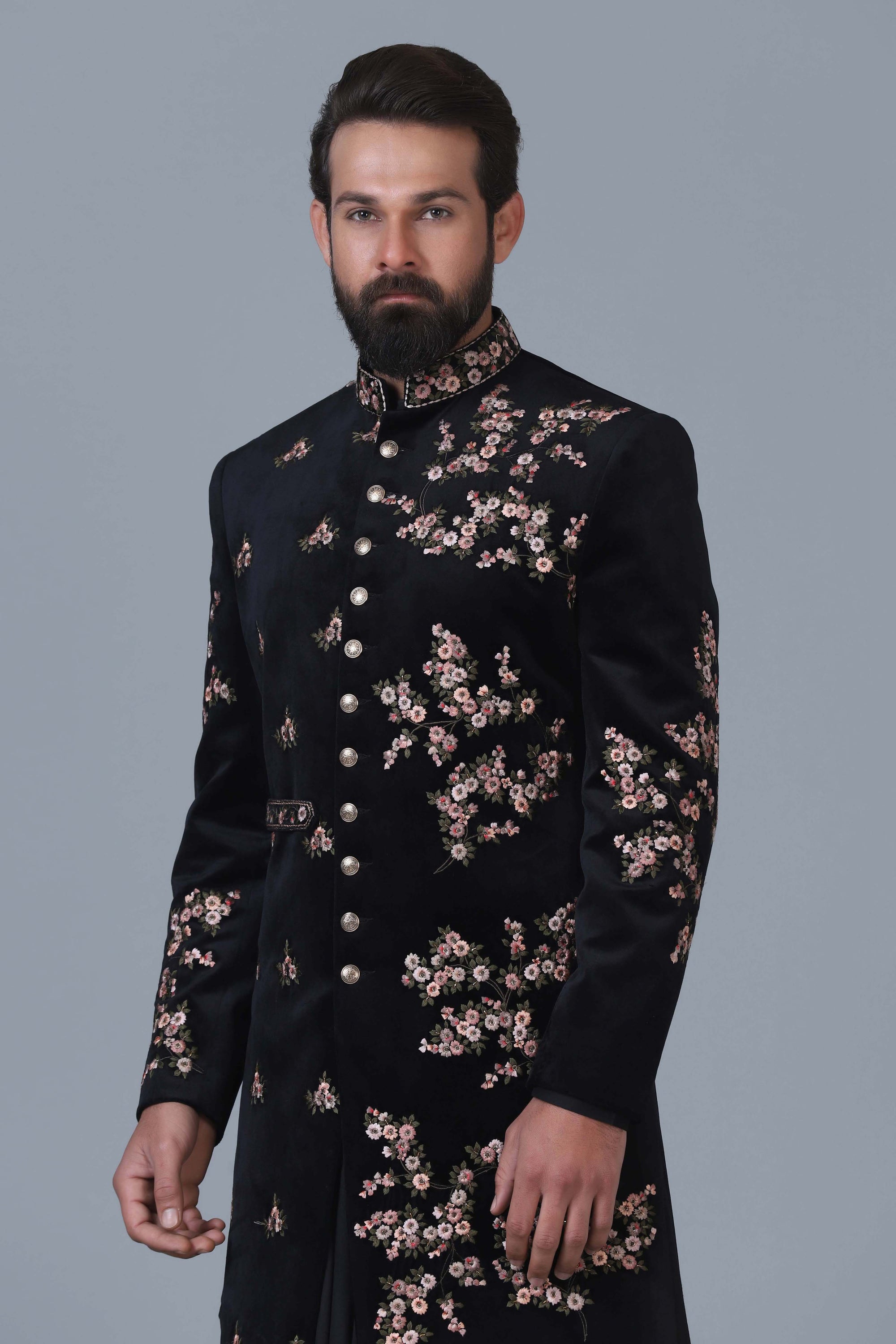 Exude sophistication in our black velvet Indowestern with intricate floral embroidery. Shop Now!
