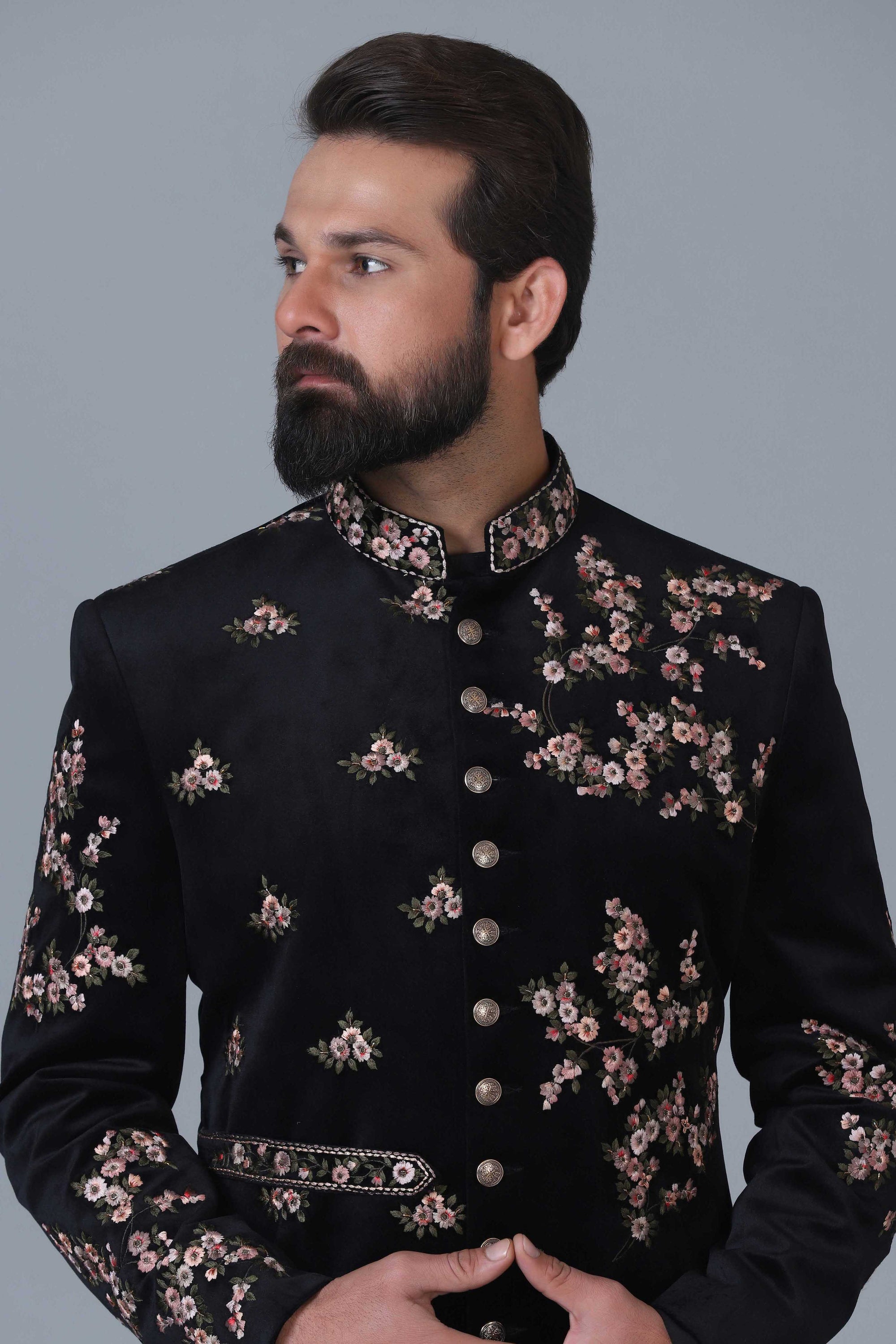 Exude sophistication in our black velvet Indowestern with intricate floral embroidery. Shop Now!