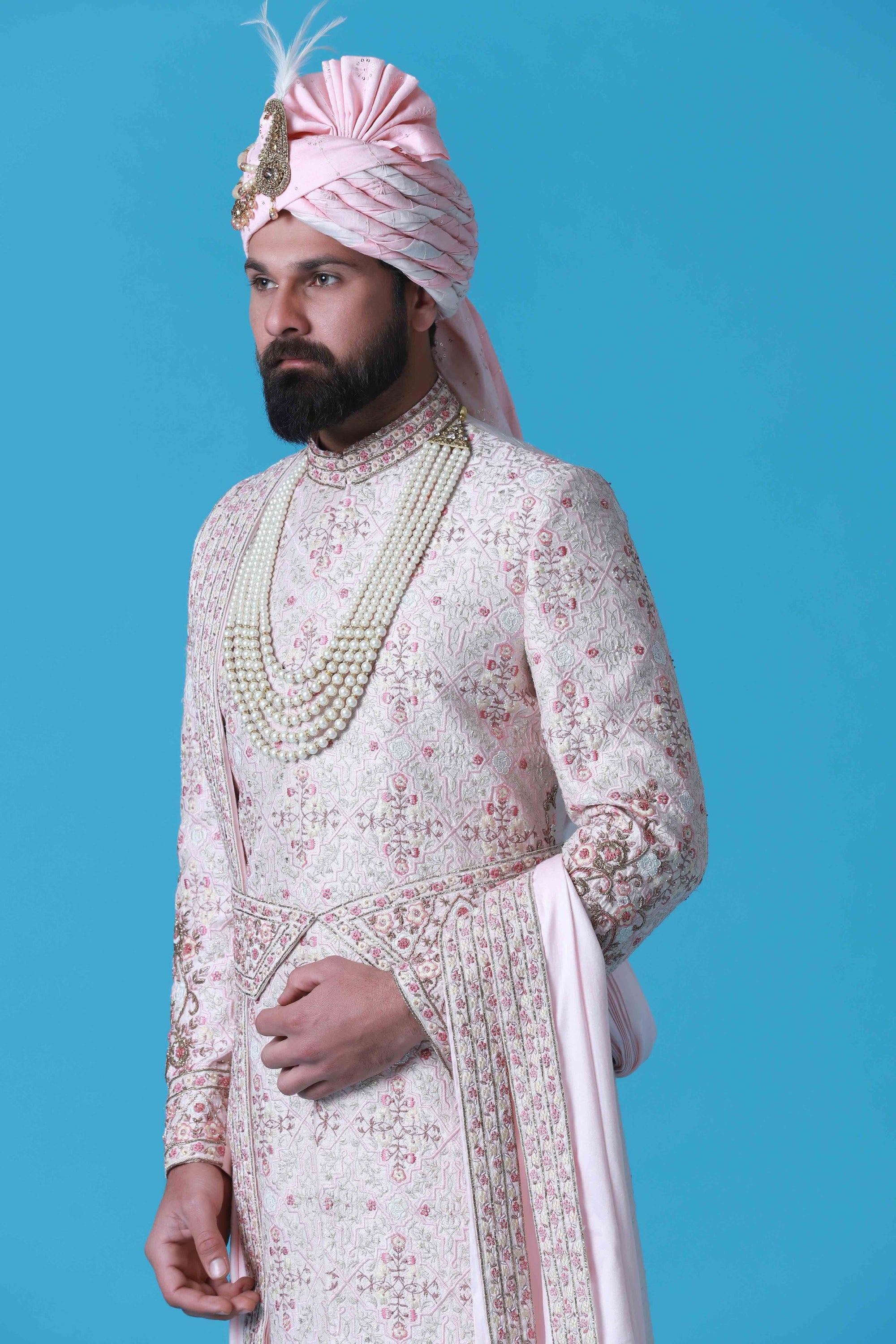Elevate your style with this regal Sherwani crafted from fine raw silk fabric. Shop Now!