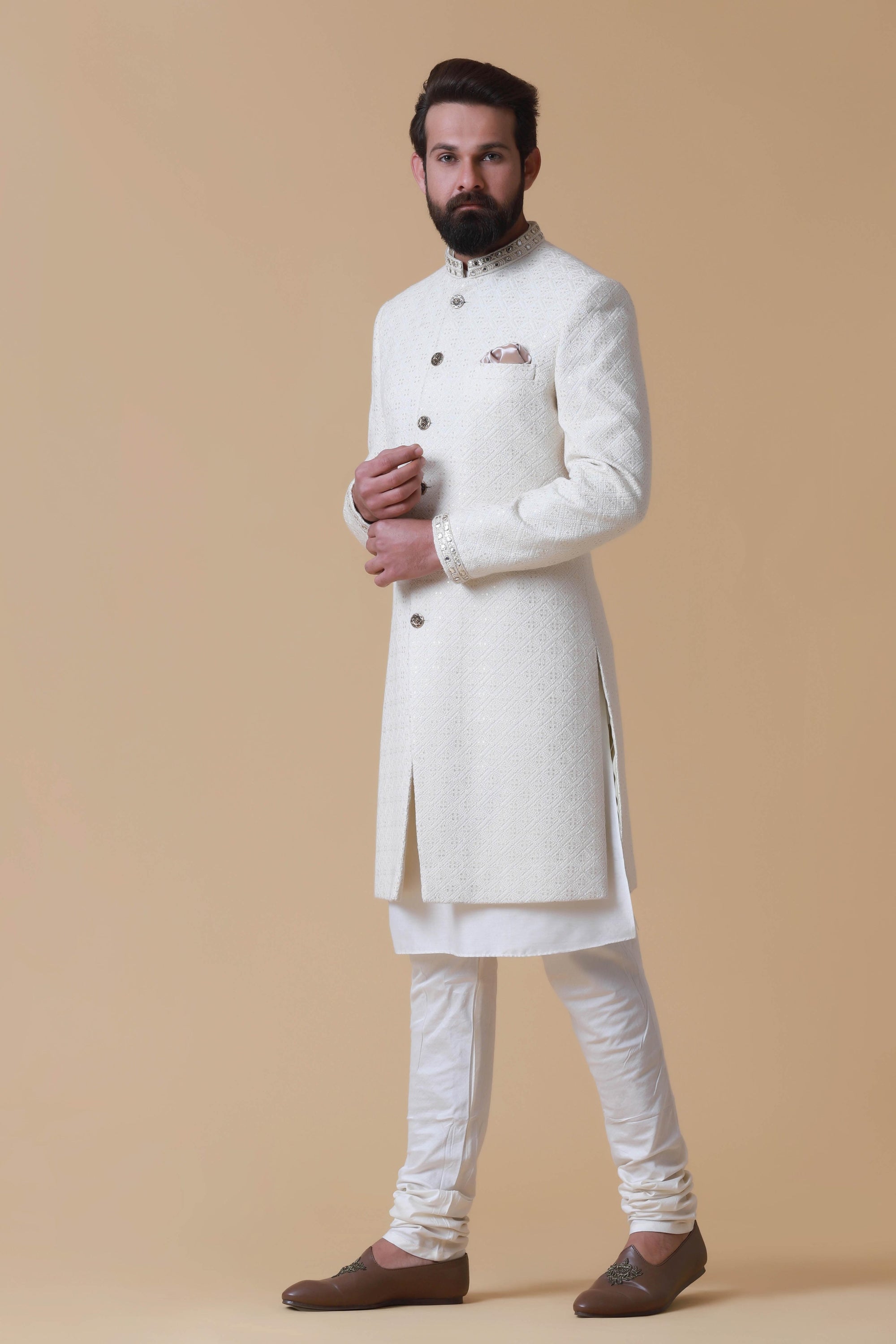 Designer Sherwani with soft colours and intricate embroidery. Shop Now!