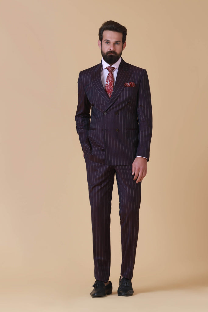 Elevate your style with our versatile Wine Pinstripe Suit. Peak lapel, 6 buttons, double vent at the back. Flat front trousers for a polished look.