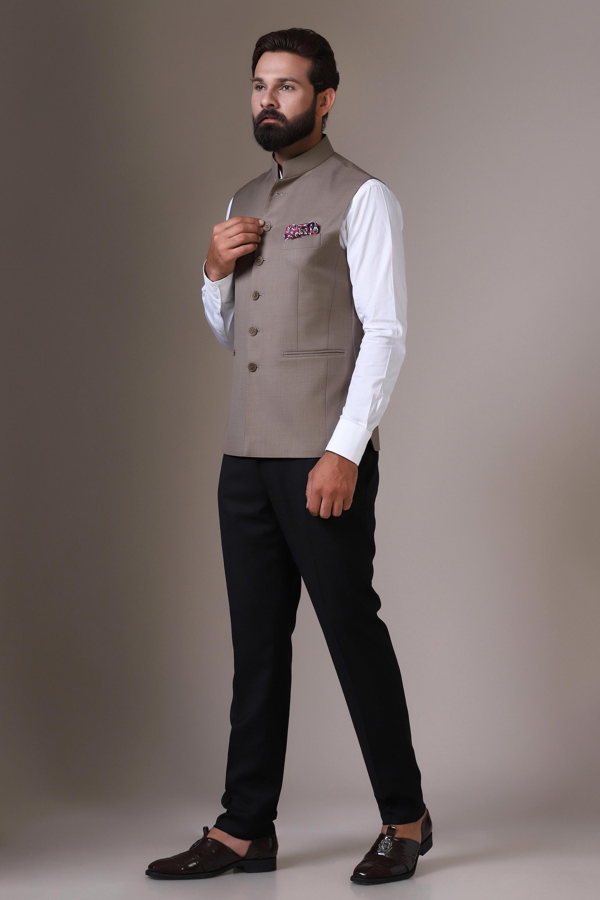 Elevate your style with our beige Nehru Jacket crafted from wool-rich fabric. Shop Now!