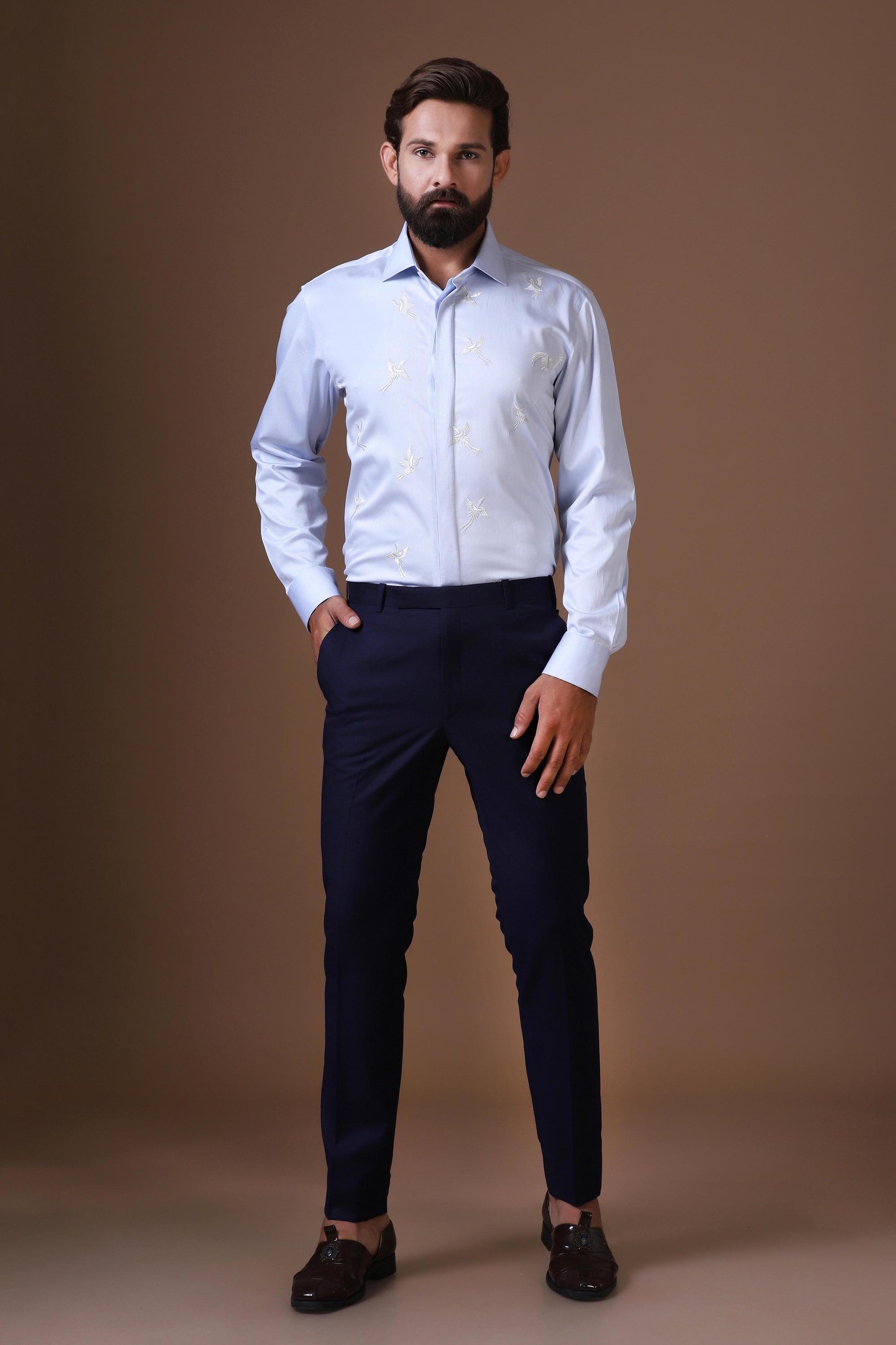 Step into style with a beautifully embroidered Blue Shirt. Shop Now!
