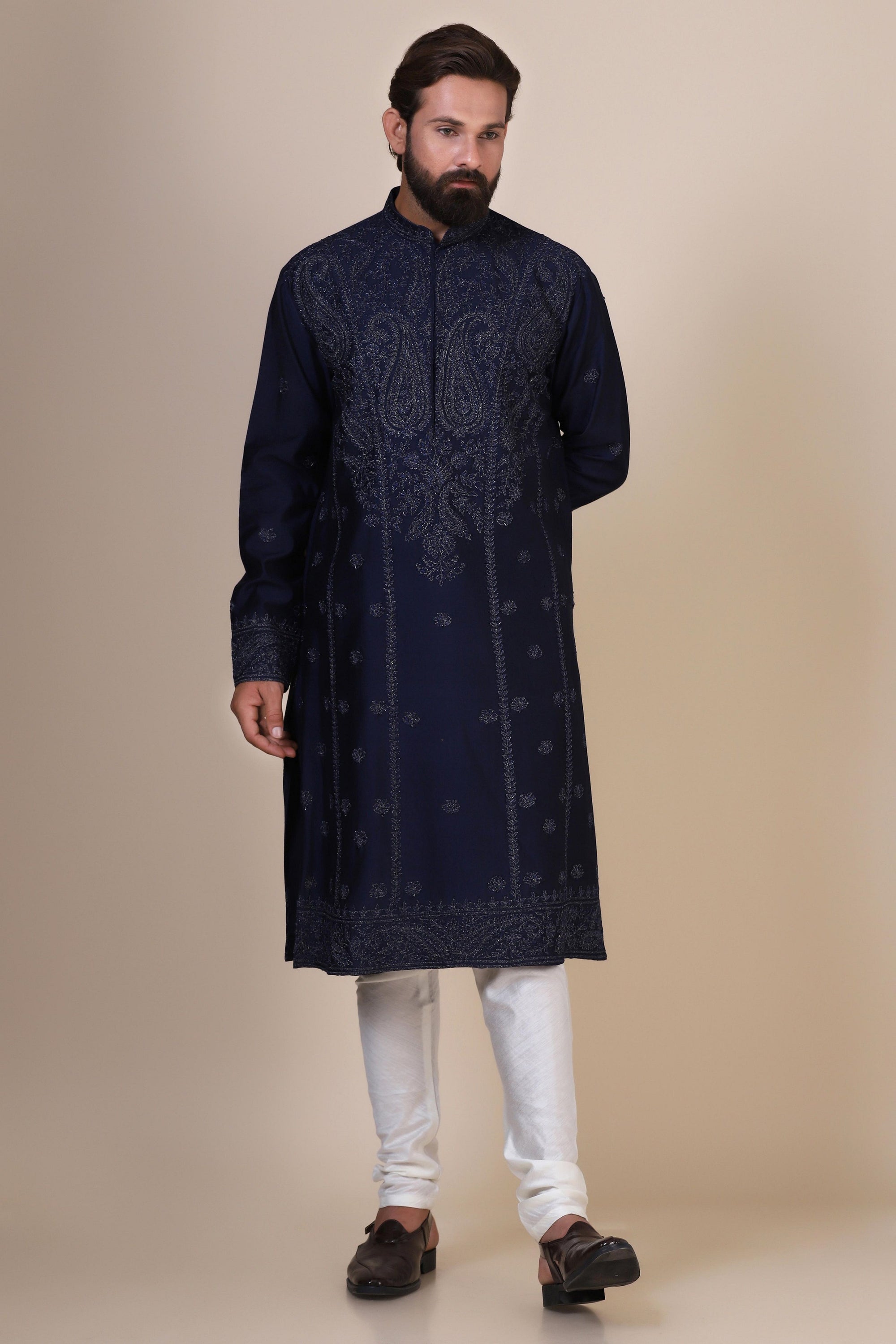 Elegance meets tradition in this Navy Kurta adorned with heavy silver embroidery. Shop Now!