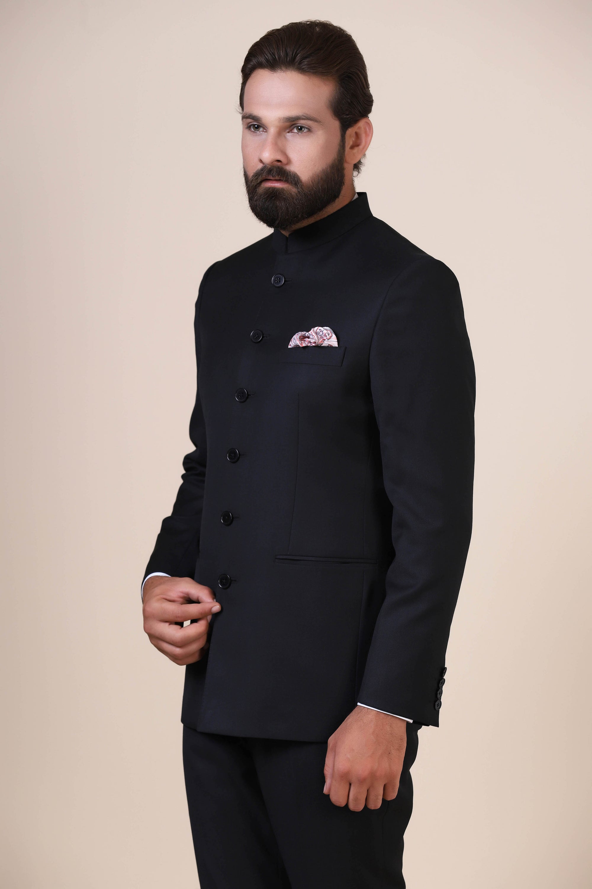 Elevate your style with our Basic Black Bandhgala suit, tailored from wool-rich fabric. Shop now!