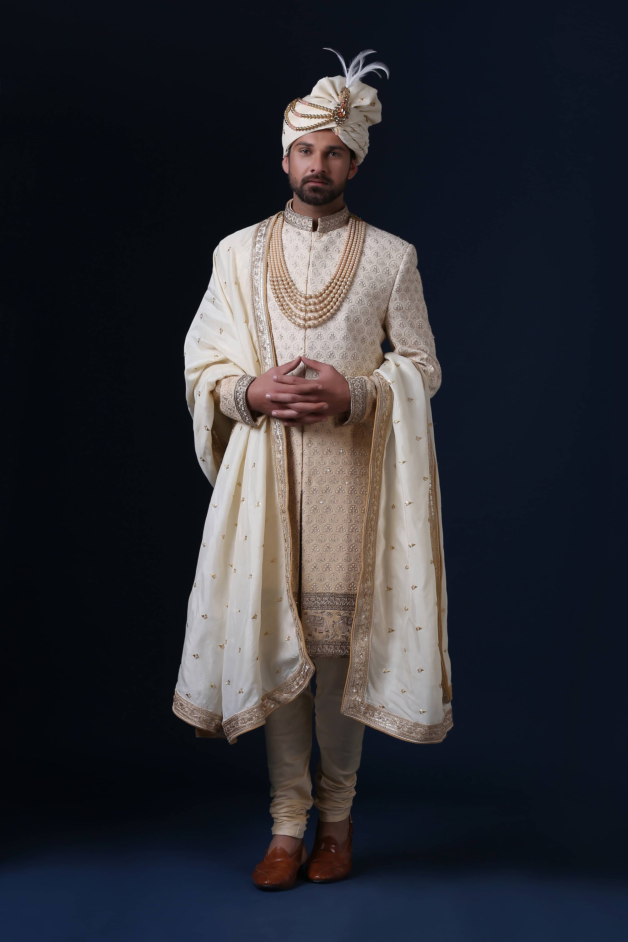 This is a Lucknowi Chikan Sherwani with an embroidery panel at the bottom. Shop Now!