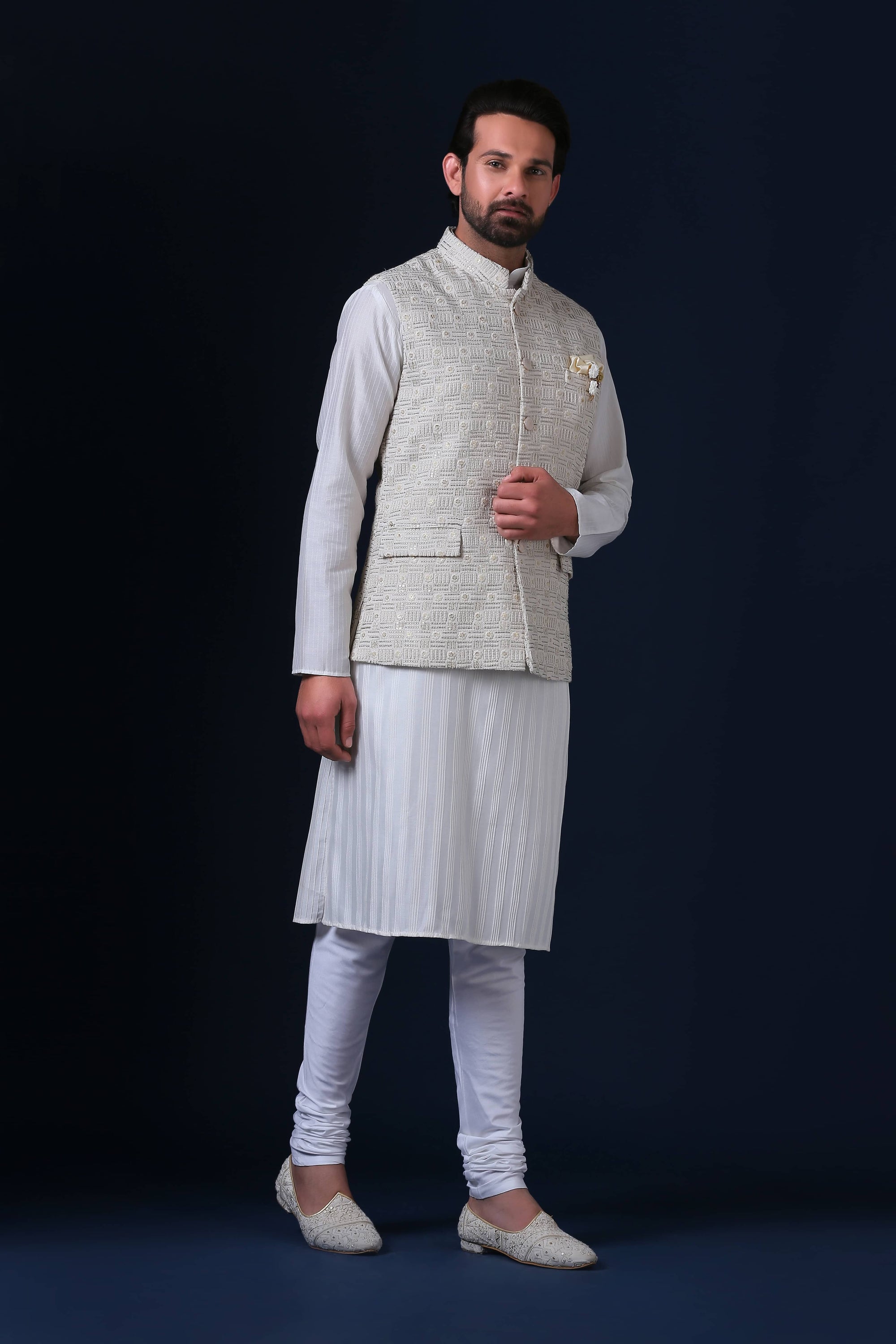 Crafted from luxurious silk jacquard, this jacket shines with pearl-finish buttons. Shop Now!